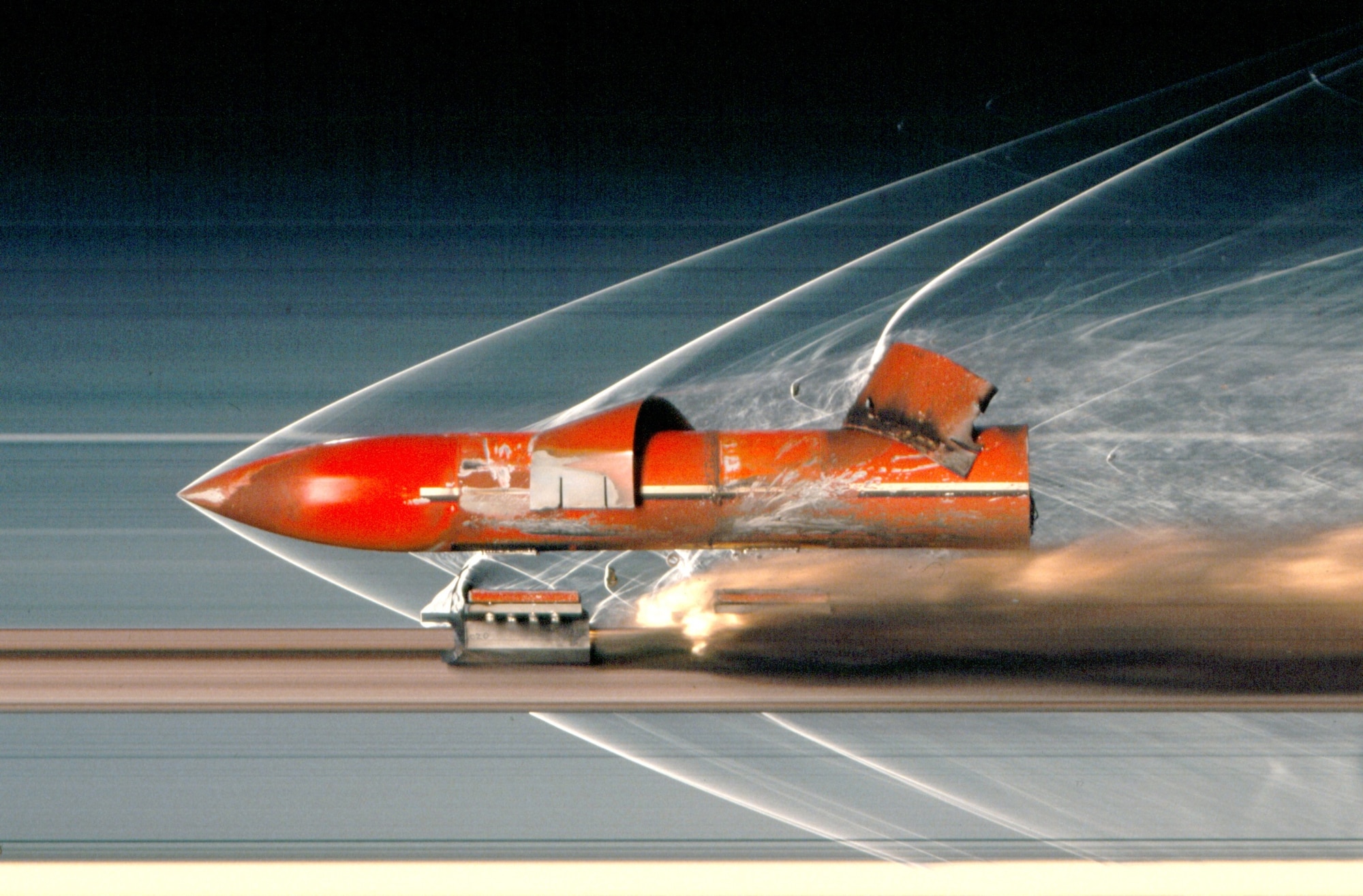 A penetrating payload speeds down the Holloman High Speed Test Track at Holloman Air Force Base, New Mexico, toward an intended target during impact testing, which is among the various types of tests performed at the HHSTT. The test track is operated by the 846th Test Squadron, a unit of the 704th Test Group of the Arnold Engineering Development Complex, headquartered at Arnold Air Force Base, Tenn. Personnel in the 846 TS are currently exploring the modernization of 71-year-old test track to extend its lifespan and further aid in the development of hypersonic systems. (U.S. Air Force photo)