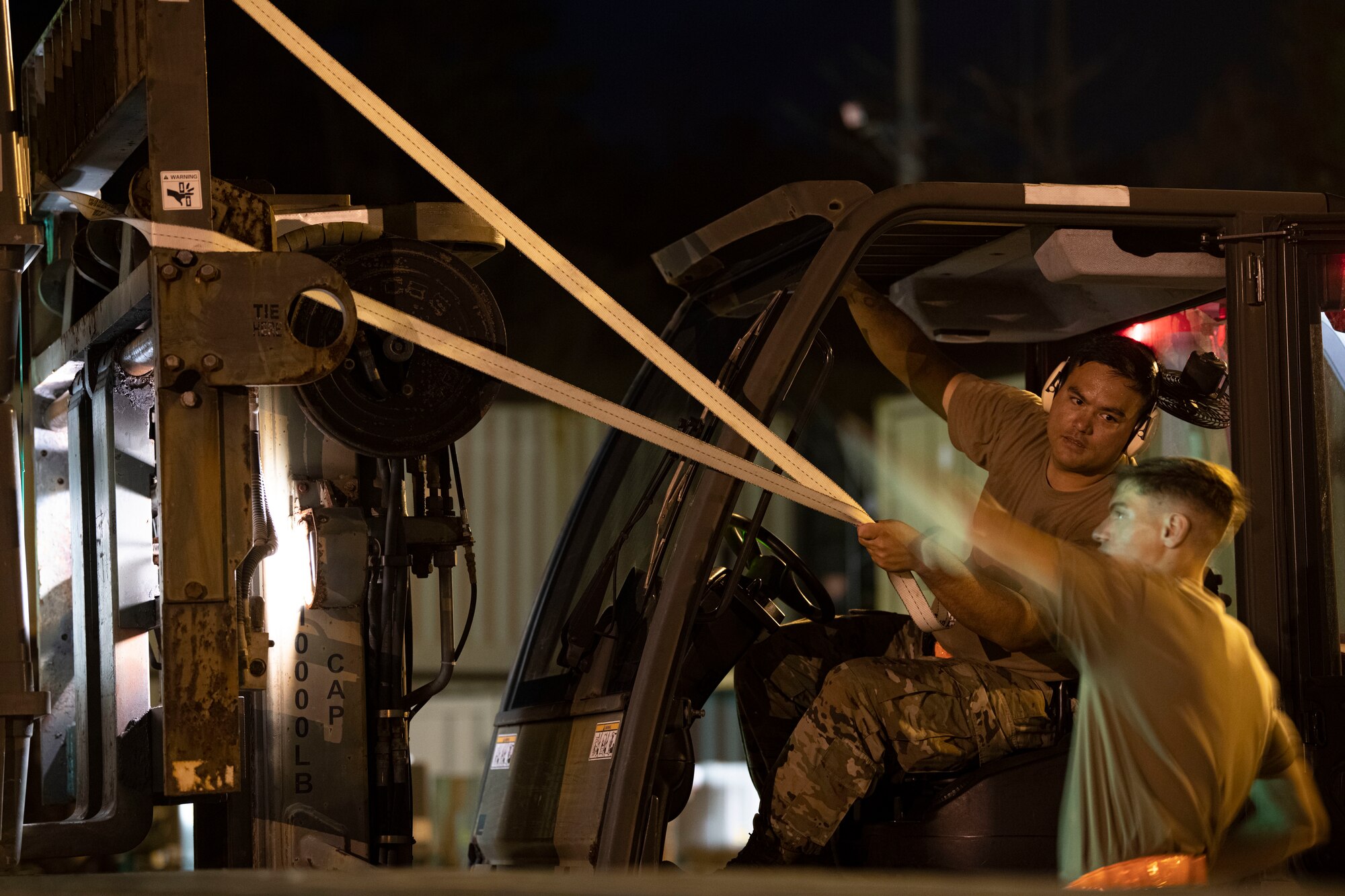 18th MUNS Airmen operate a forklift
