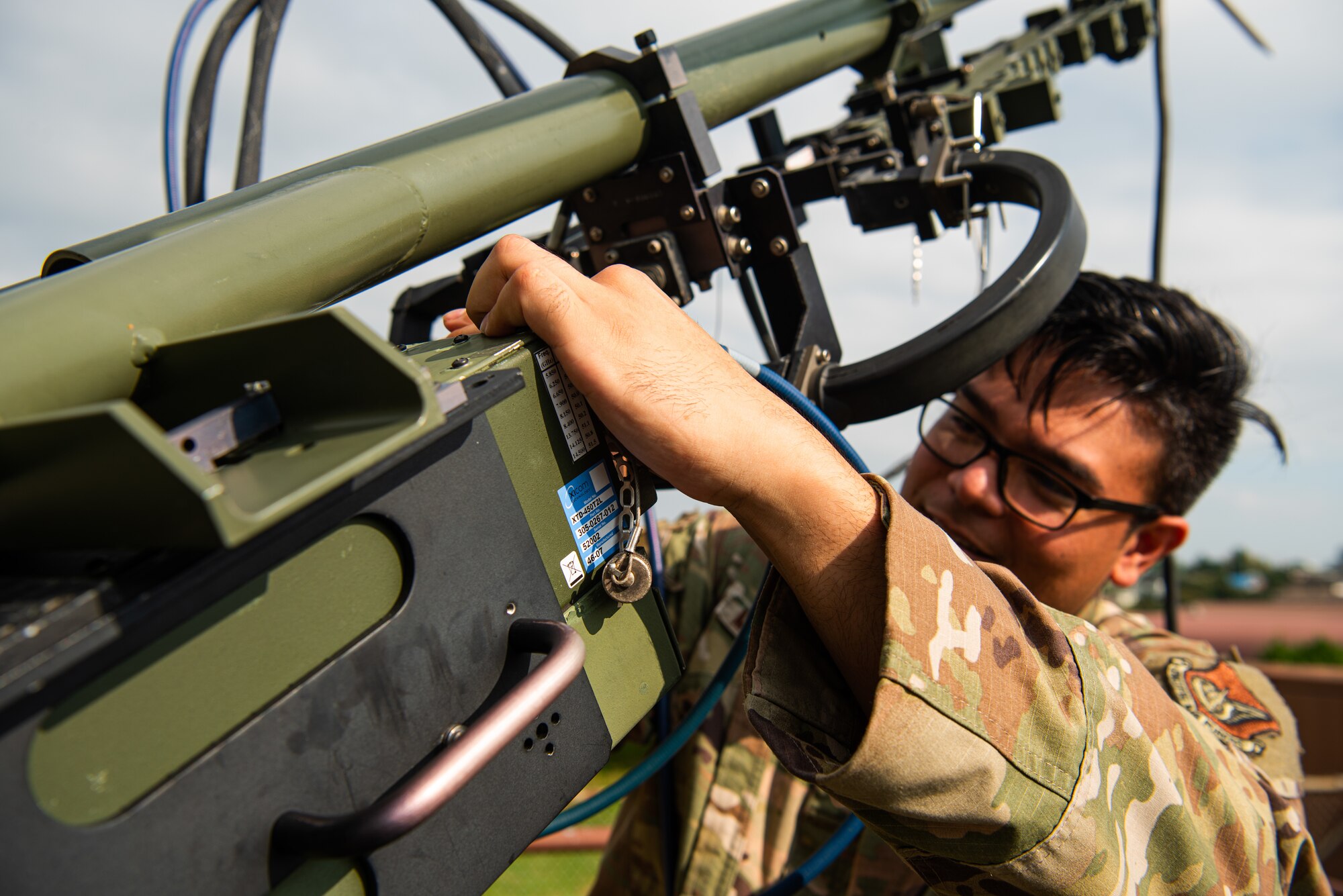 Staff Sgt. Tyler McNaughton, 51st Communications Squadron radio frequency transmission supervisor, operates a Very Small Aperture Antenna (VSAT) during a resiliency exercise at Osan Air Base, Republic of Korea, Oct. 6, 2021.