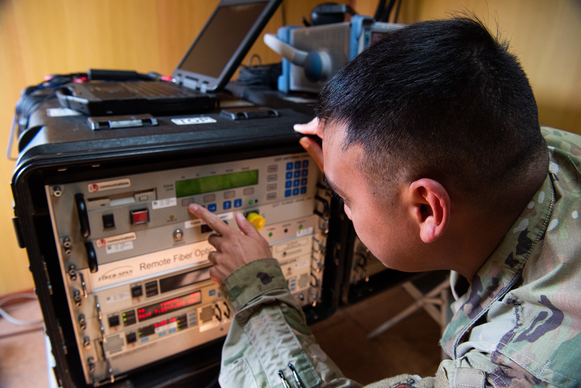 Staff Sgt. Dean Sigismundo, 51st Communications Squadron radio frequency transmission supervisor, begins the power down process on the Ground Multiband Terminal (GMT) at Osan Air Base, Republic of Korea, Oct. 6, 2021.