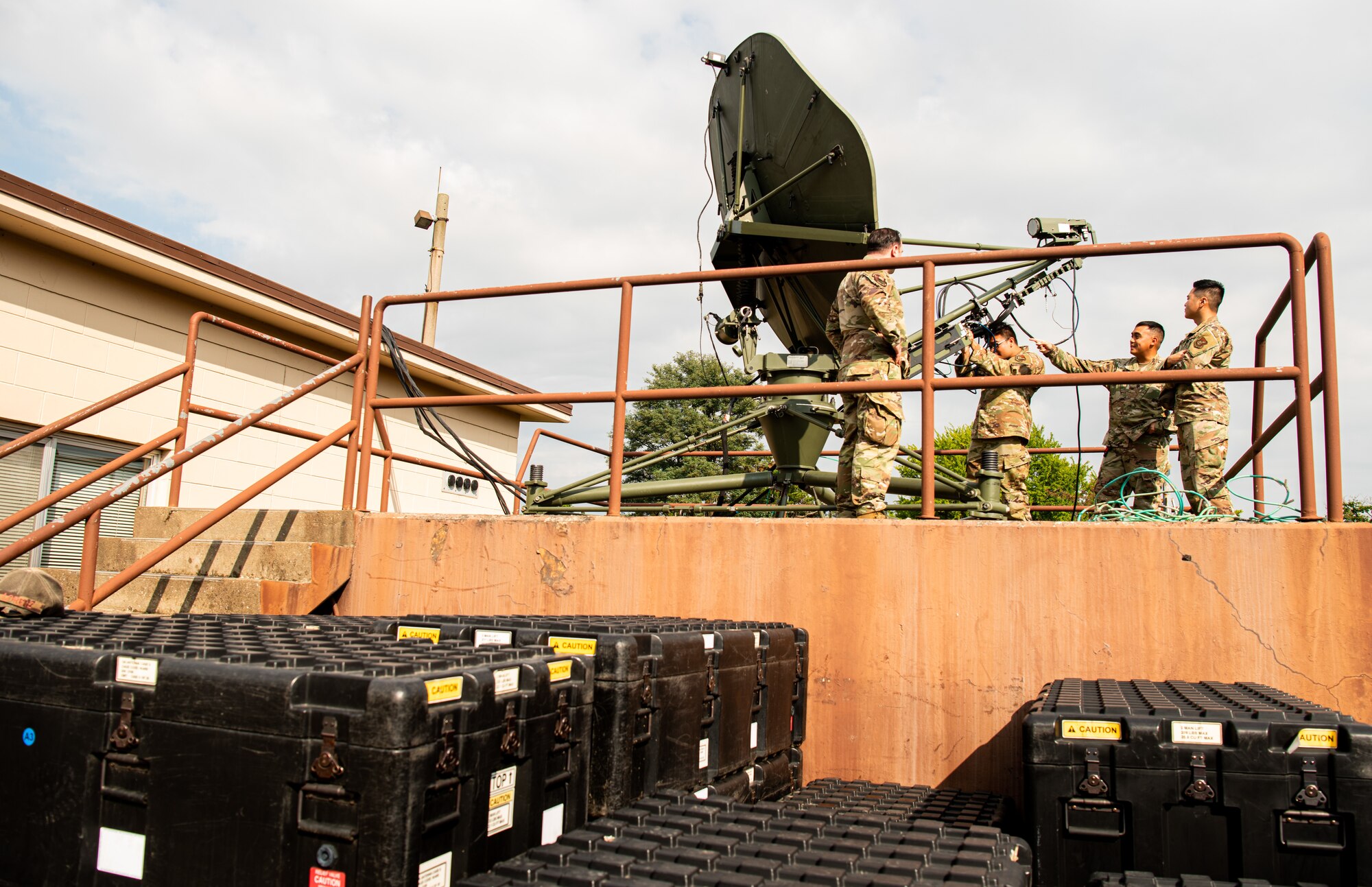 51st Communications Squadron Airmen examine and operate a Very Small Aperture Antenna (VSAT) during a resiliency exercise Osan Air Base, Republic of Korea, Oct. 6, 2021.