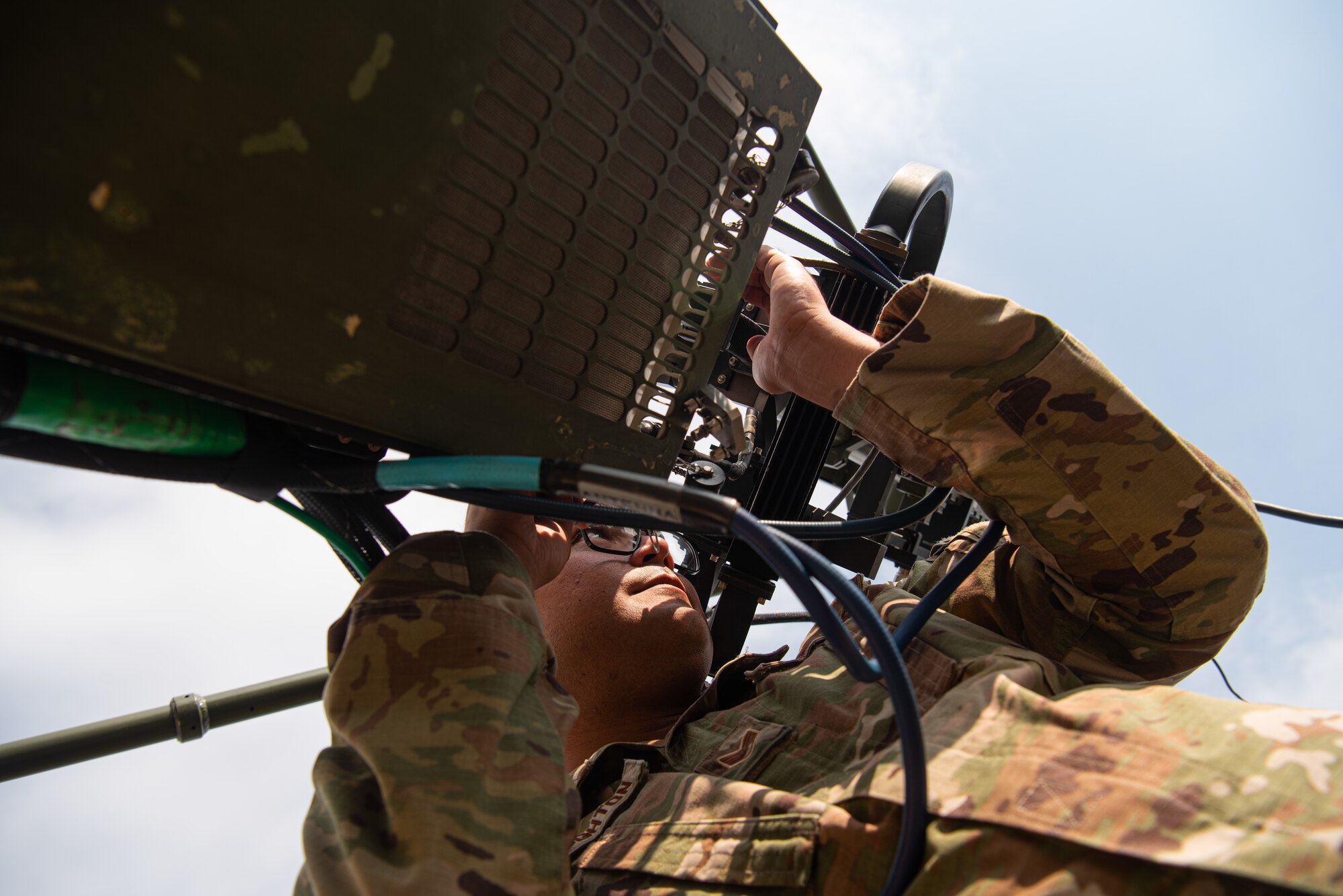 Staff Sgt. Tyler McNaughton, 51st Communications Squadron radio frequency transmission supervisor, works on a Very Small Aperture Antenna (VSAT) during a resiliency exercise at Osan Air Base, Republic of Korea, Oct. 6, 2021.