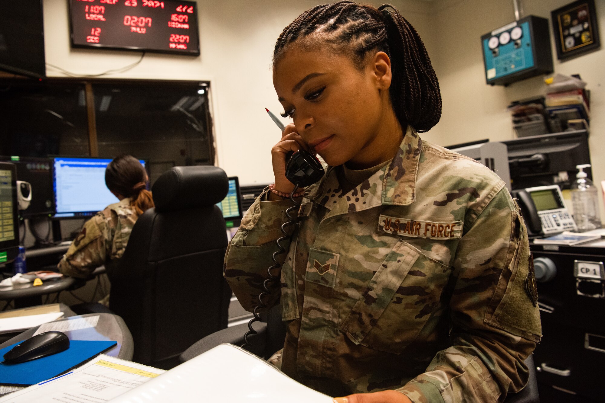 Senior Airman D’Eryka Corpuz, 51st Fighter Wing Command Post emergency action controller, completes a checklist Sept. 30, 2021, at Osan Air Base, Republic of Korea.