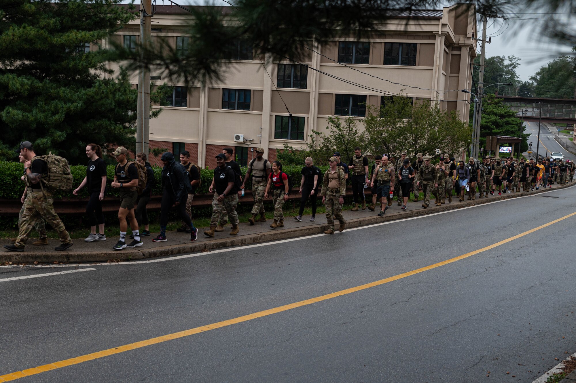 Airmen participate in a 3-mile ruck march