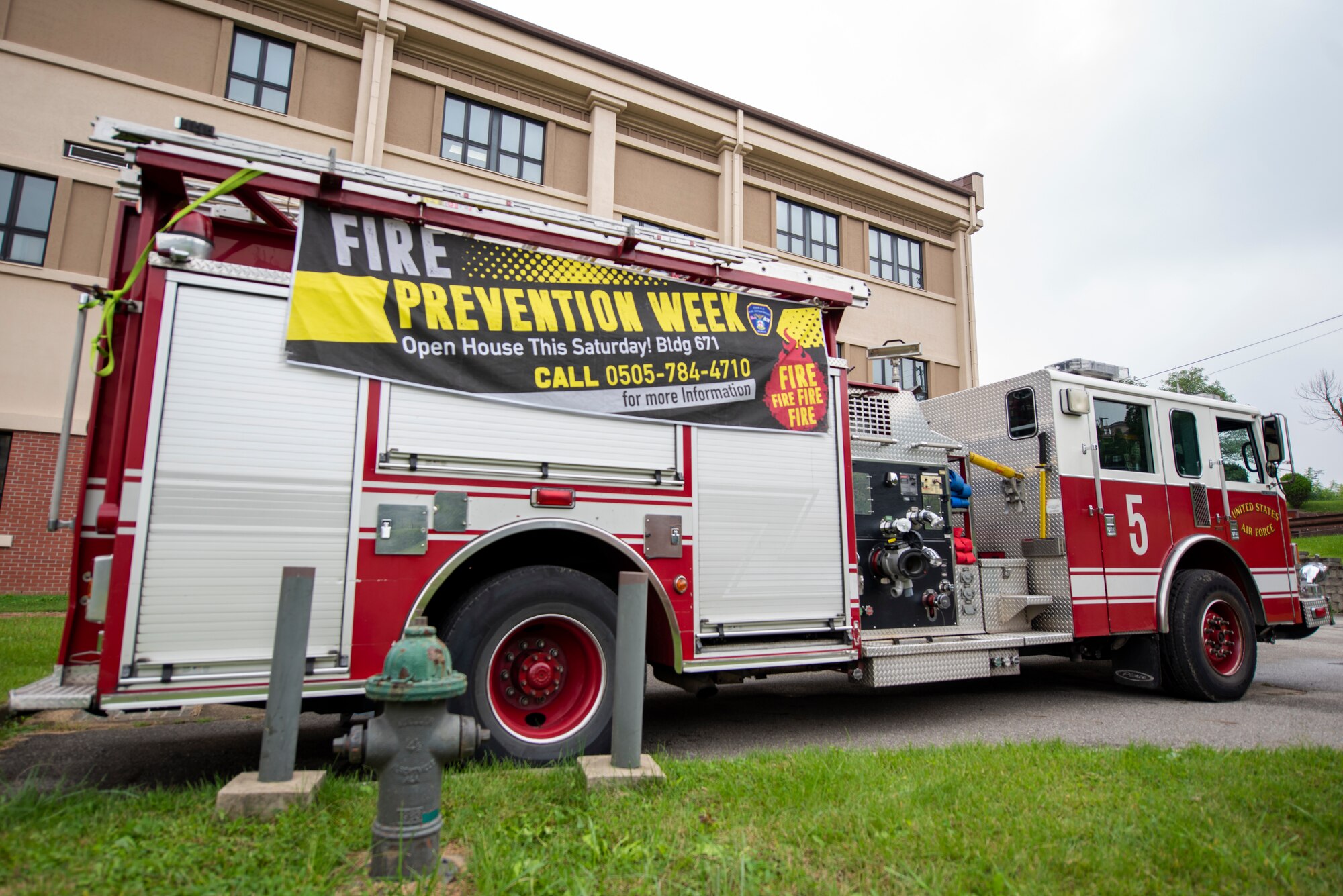 51st Civil Engineer Squadron firemen display one of their firetrucks for Osan Air Base families during the Fire Prevention Week Kids’ Showcase