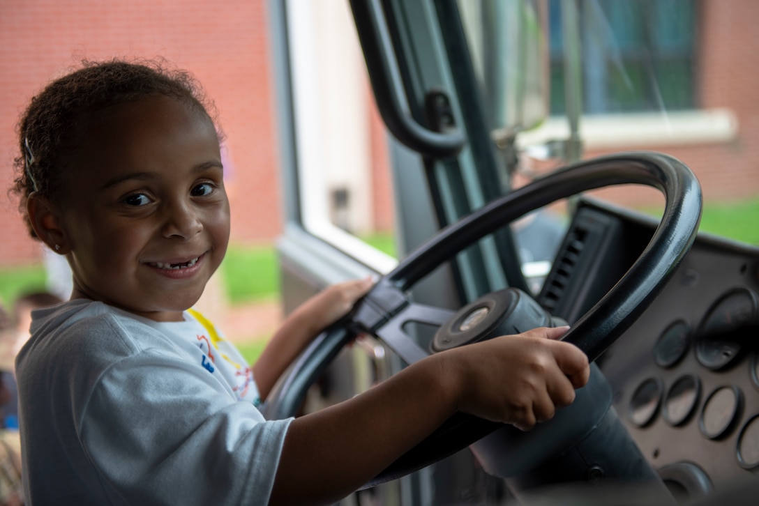 A child attendee tours a 51st Civil Engineer Squadron firetruck during the Fire Prevention Week’s Kids Showcase