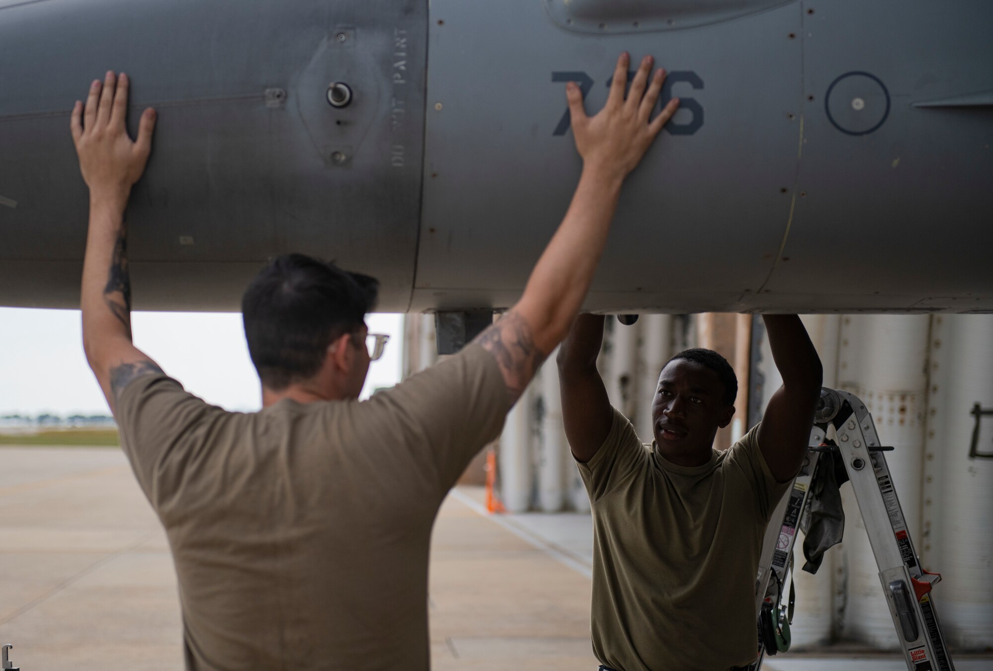 Senior Airmen Chase Peace and Ian Njoroge, 80th Aircraft Maintenance Unit avionics technicians, troubleshoot the fire control radar on an F-16 Fighting Falcon at Kunsan Air Base, Republic of Korea, Oct. 5, 2021. Avionics technicians are responsible for maintaining and repairing highly sophisticated avionics systems to ensure pilots receive the information they need to successfully operate their aircraft. (U.S. Air Force photo by Senior Airman Suzie Plotnikov)