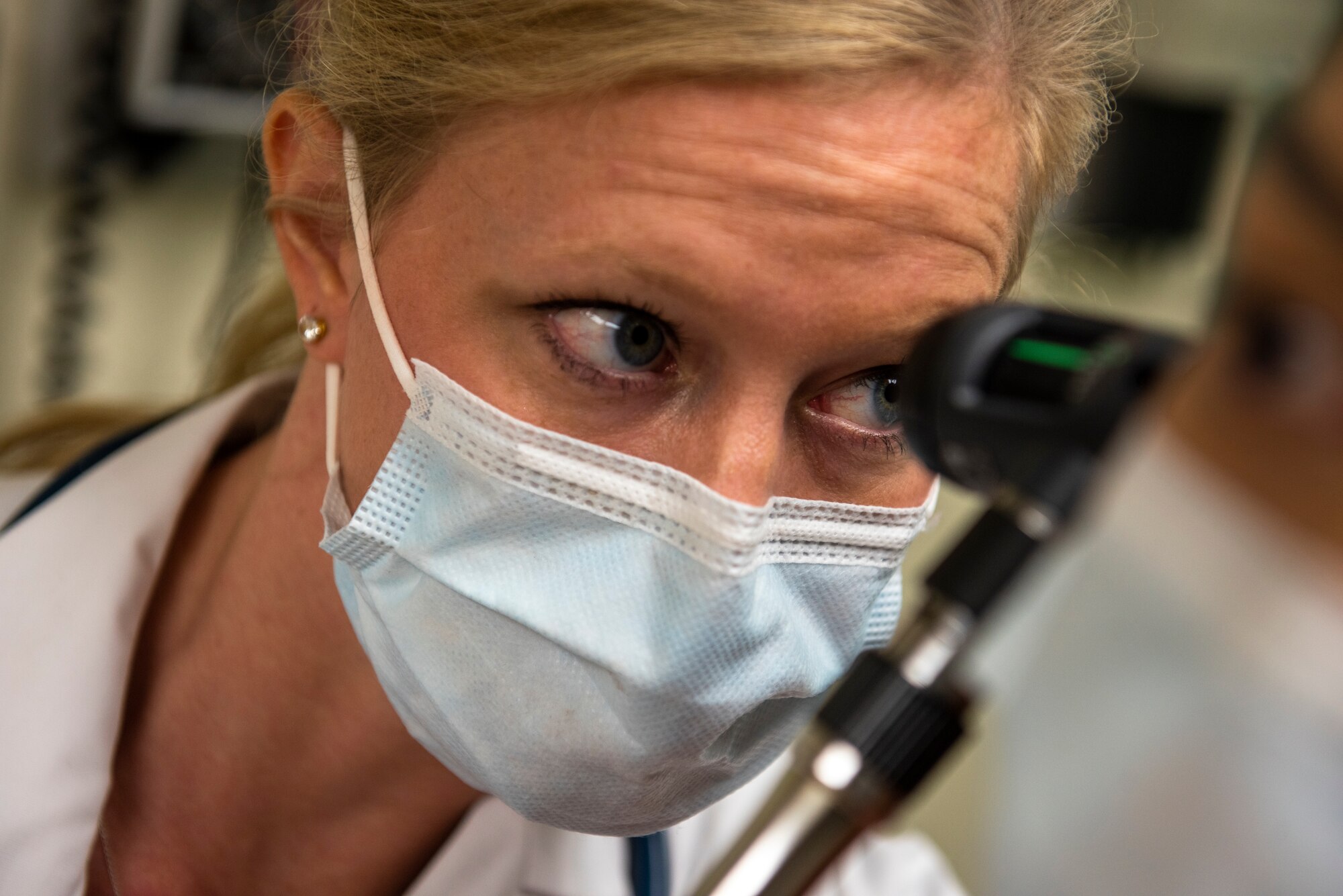 Capt. Amber Tordoff, 51st Operational Medical Readiness Squadron physician assistant, inspects a patient