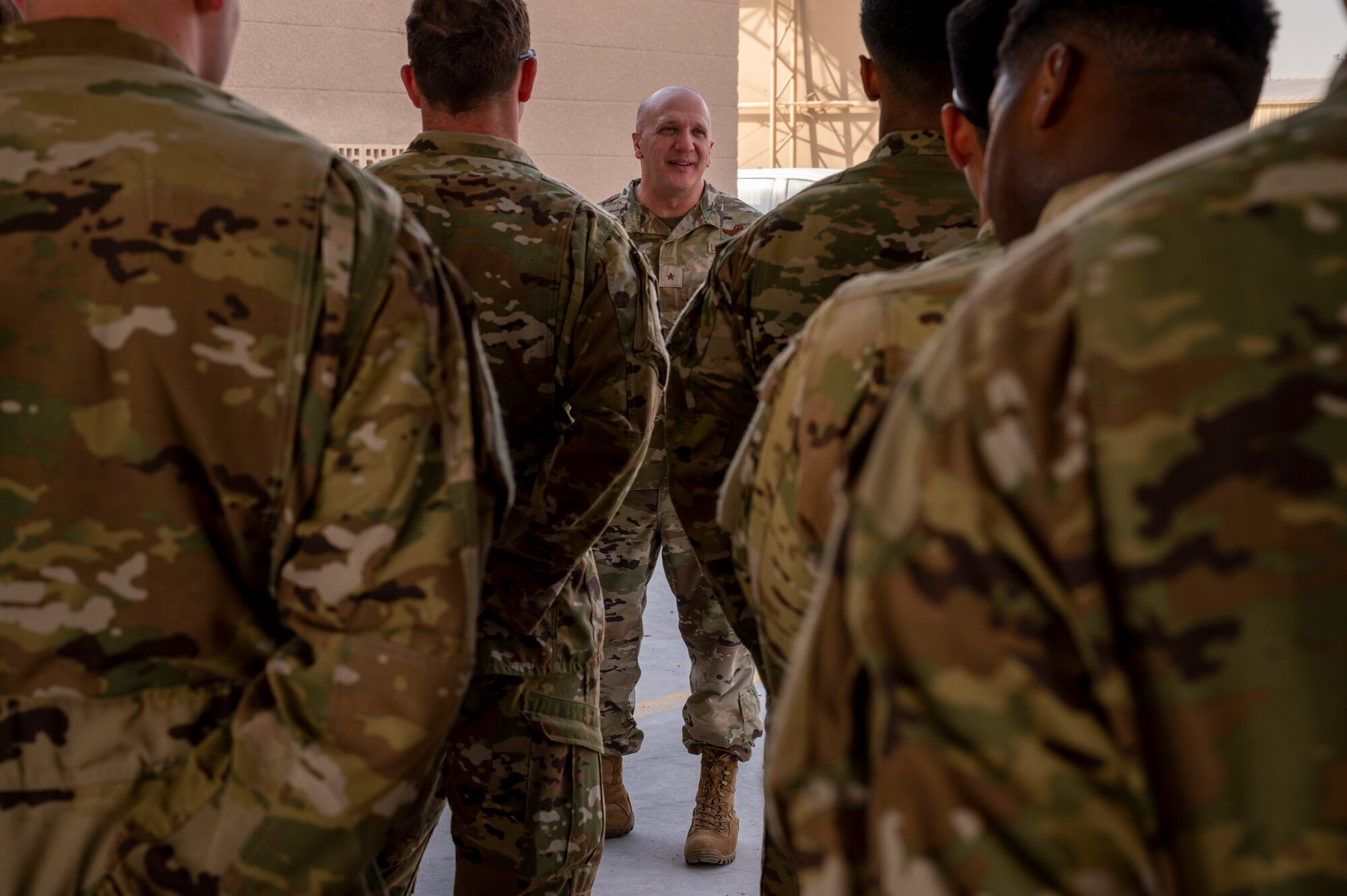Brig. Gen. Gerald Donohue, 379th Air Expeditionary Wing commander, speaks to Airmen from the 379th Expeditionary Civil Engineer Squadron after signing the Fire Prevention Week proclamation Oct. 5, 2021, at Al Udeid Air Base, Qatar.