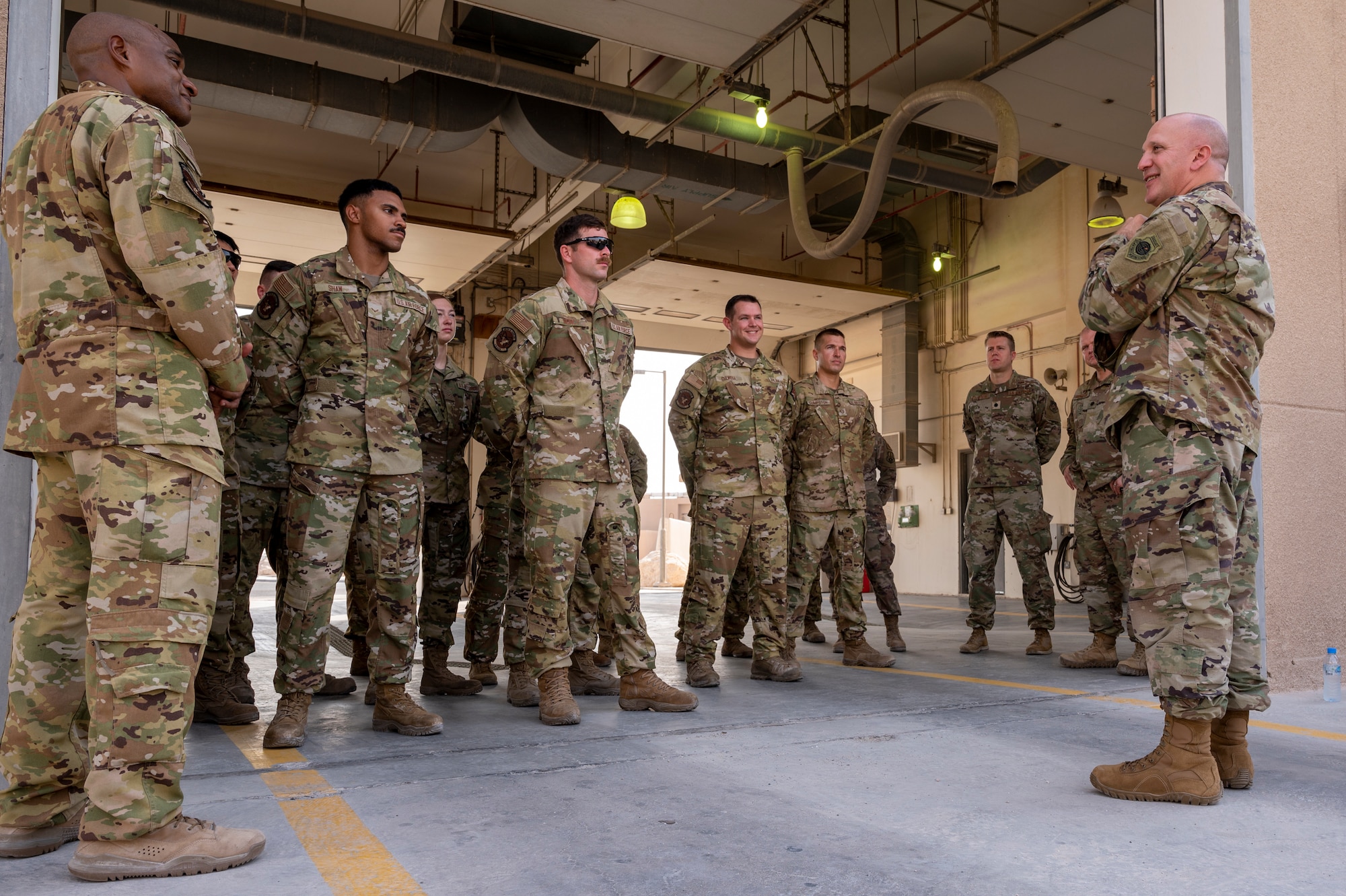 Brig. Gen. Gerald Donohue, 379th Air Expeditionary Wing commander, speaks to Airmen from the 379th Expeditionary Civil Engineer Squadron after signing the Fire Prevention Week proclamation Oct. 5, 2021, at Al Udeid Air Base, Qatar.