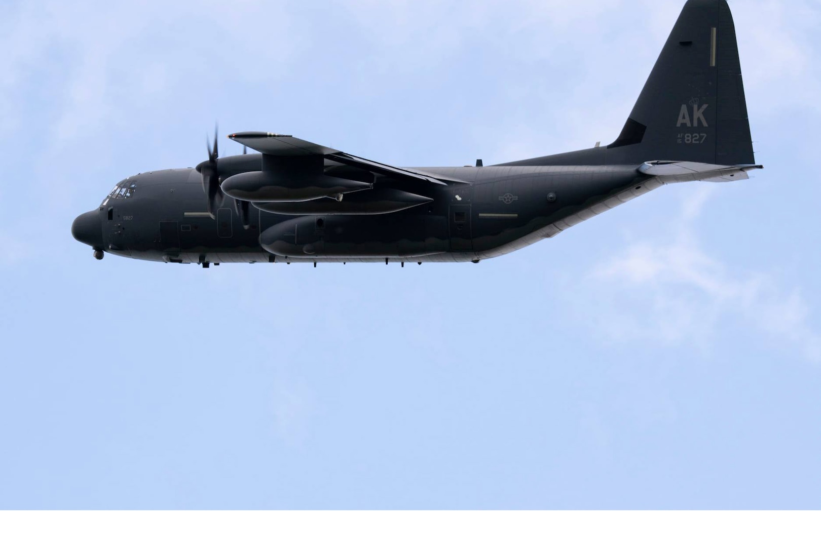 An Alaska Air National Guard HC-130J Combat King II operated by aircrew from the 211th Rescue Squadron, 176th Wing, over Malemute Drop Zone at Joint Base Elmendorf-Richardson, Alaska, Aug. 18, 2021. The HC-130J Combat King II can perform personnel recovery operations, search-and-rescue and aerial helicopter refueling and forward area ground refueling missions.