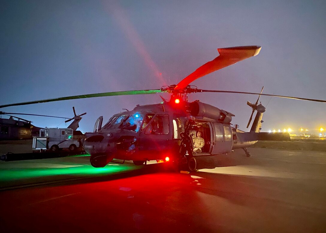 An HH-60G Pave Hawk sits on an airfield