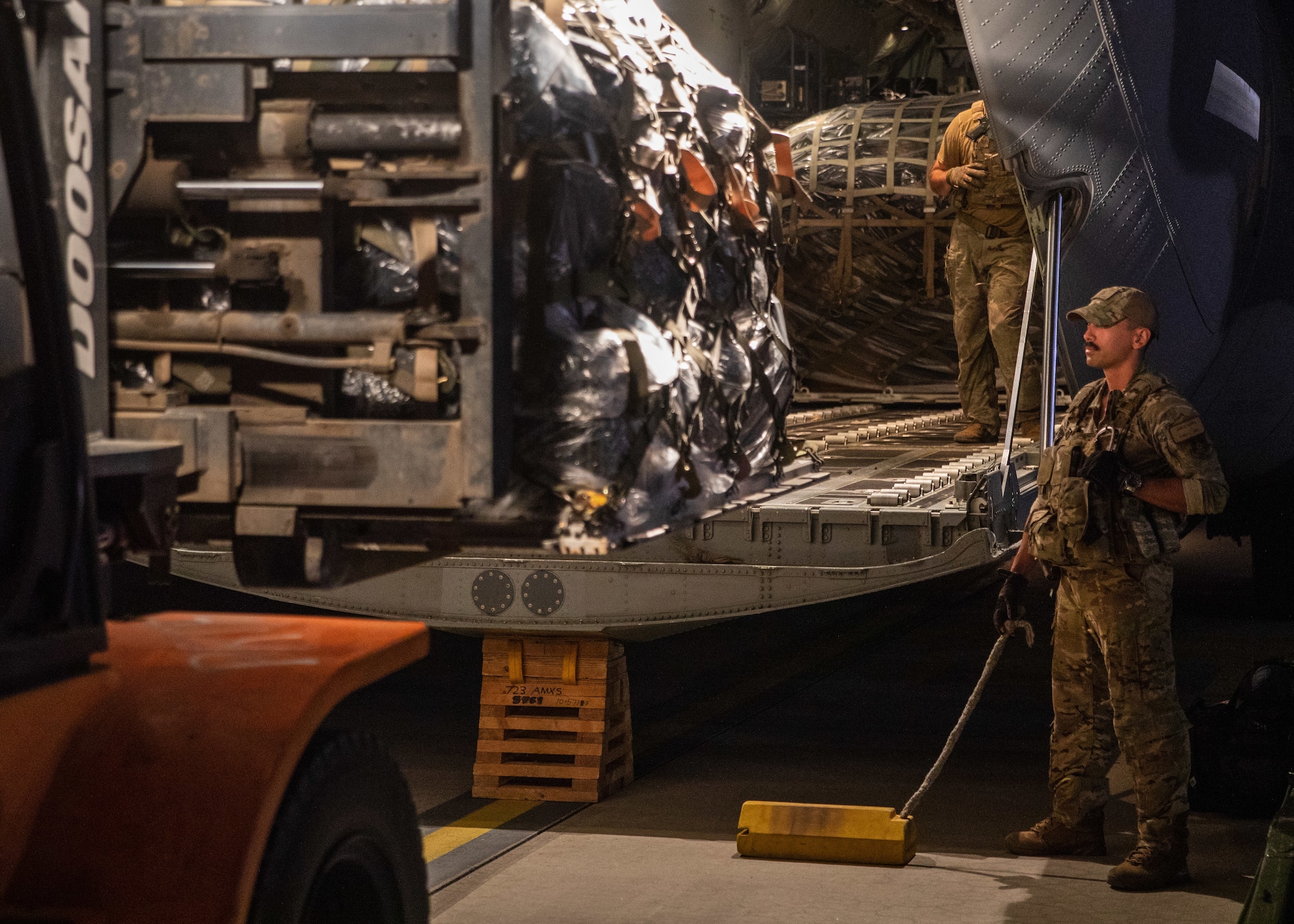 Airmen load cargo