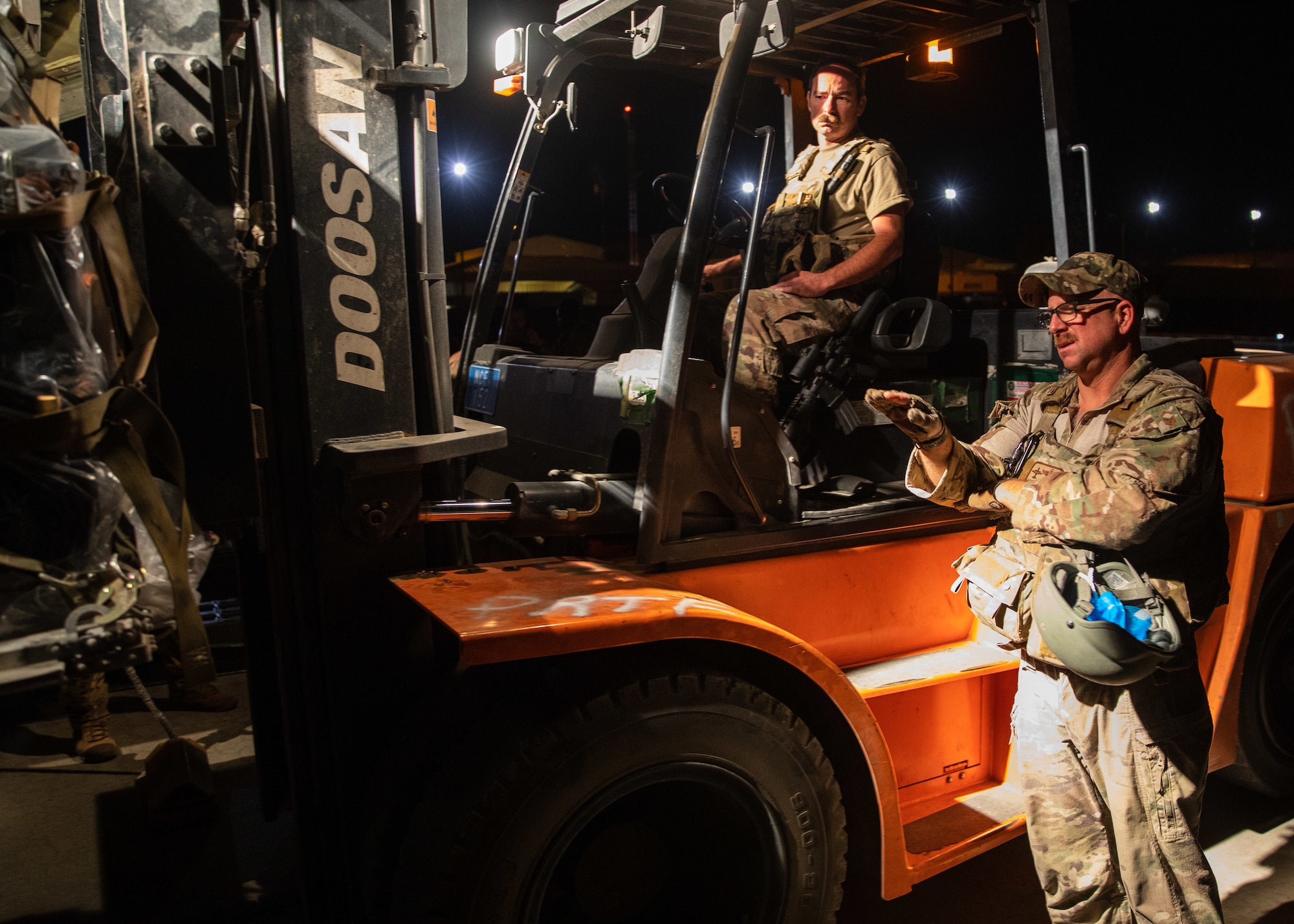 Airmen load cargo