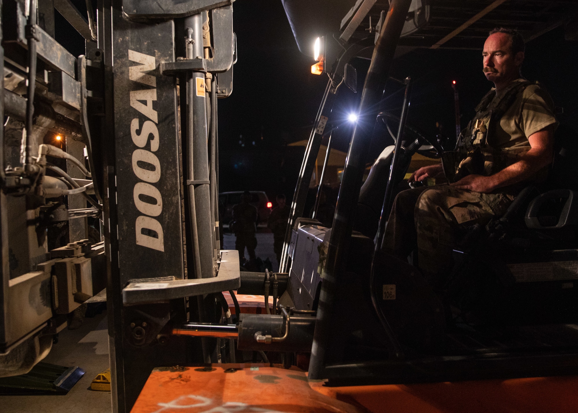 Airmen load cargo