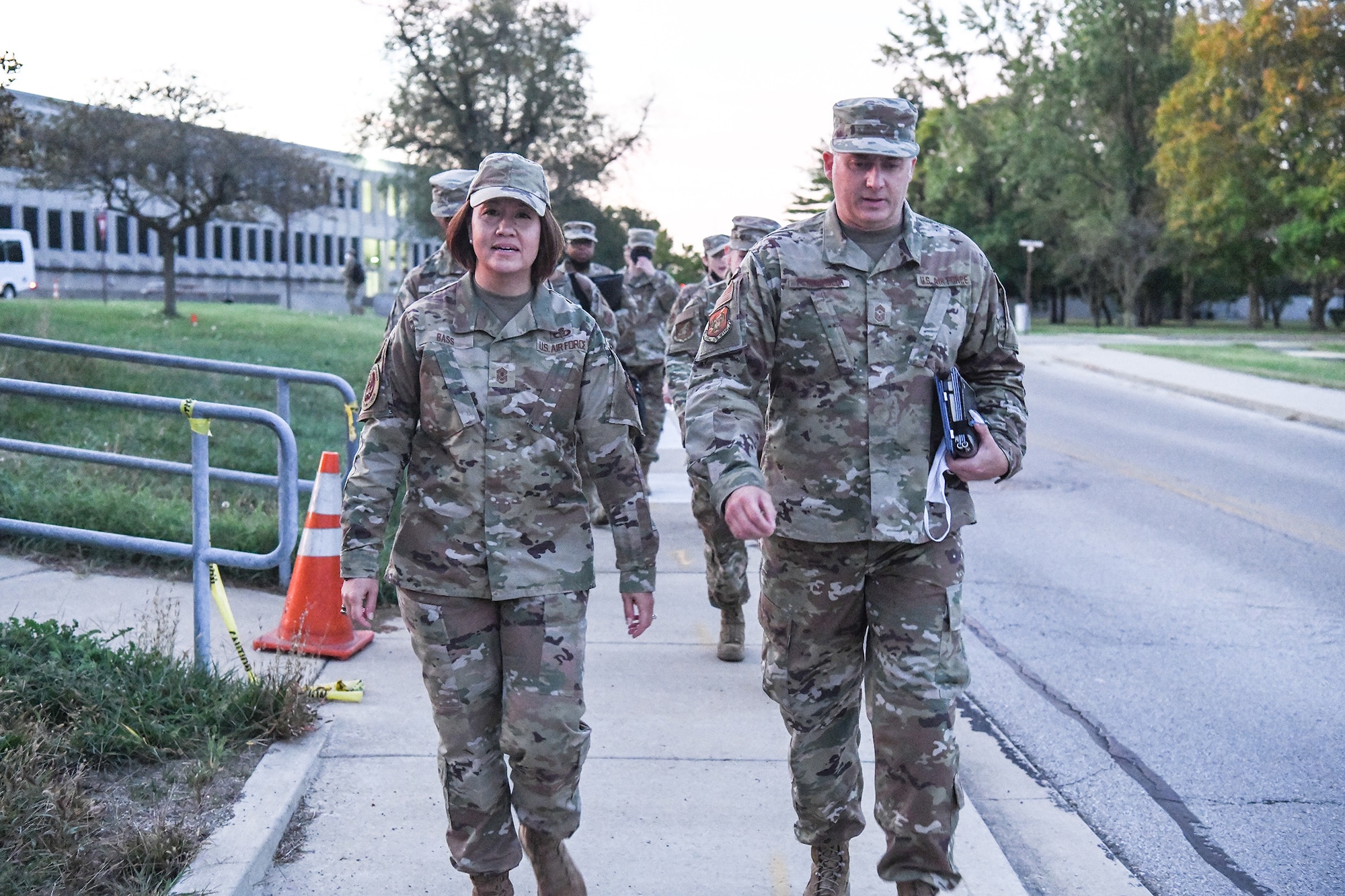 Chief Master Sgt. Bohdan Pywowarczuk, II, 655th Intelligence, Surveillance and Reconnaissance Wing command chief, escorts Chief Master Sgt. of the Air Force JoAnne Bass and her team to Bldg. 822 Oct. 2, 2021 to participate in an enlisted call and to meet with Reserve Citizen Airmen from the 655th. At the enlisted call, she coined Tech. Sgt. Jana Palant, 655th Intelligence, Surveillance and Reconnaissance Group NCO in charge of readiness and training for being an exceptional performer in her unit.