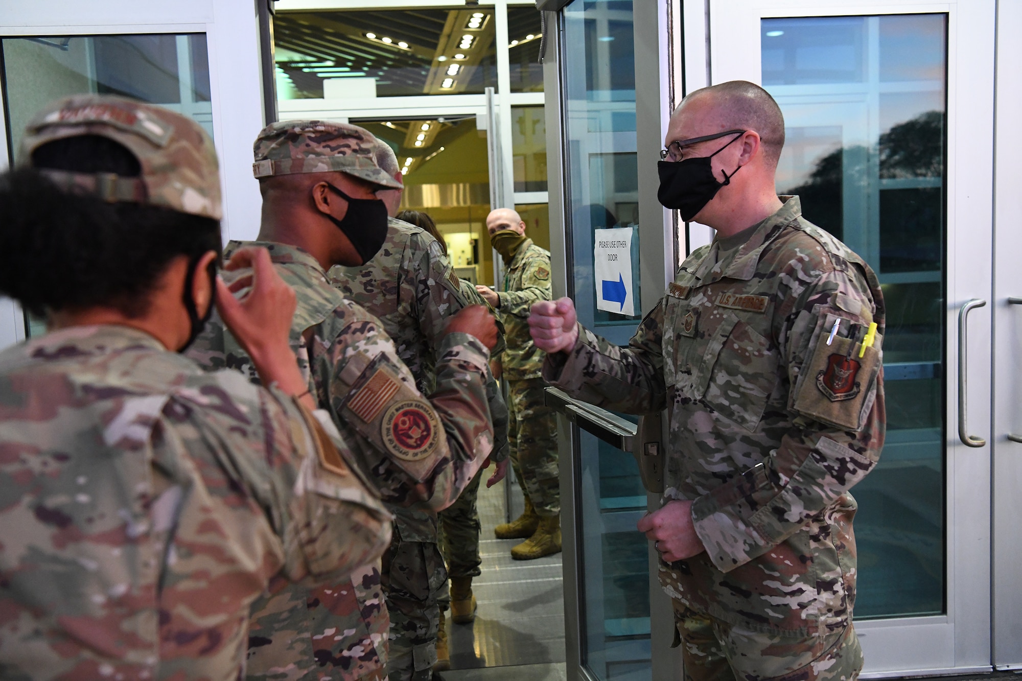 Master Sgt. Nicholas Cypher, 655th Intelligence, Surveillance and Reconnaissance Wing, escorts Chief Master Sgt. of the Air Force JoAnne Bass and her team into Bldg. 266 Oct. 2, 2021 for a wing overview briefing and to meet with Reserve Citizen Airmen from the 655th. During her visit to the wing, Bass also participated in an enlisted call where she coined Tech. Sgt. Jana Palant, 655th Intelligence, Surveillance and Reconnaissance Group NCO in charge of readiness and training for being an exceptional performer in her unit.