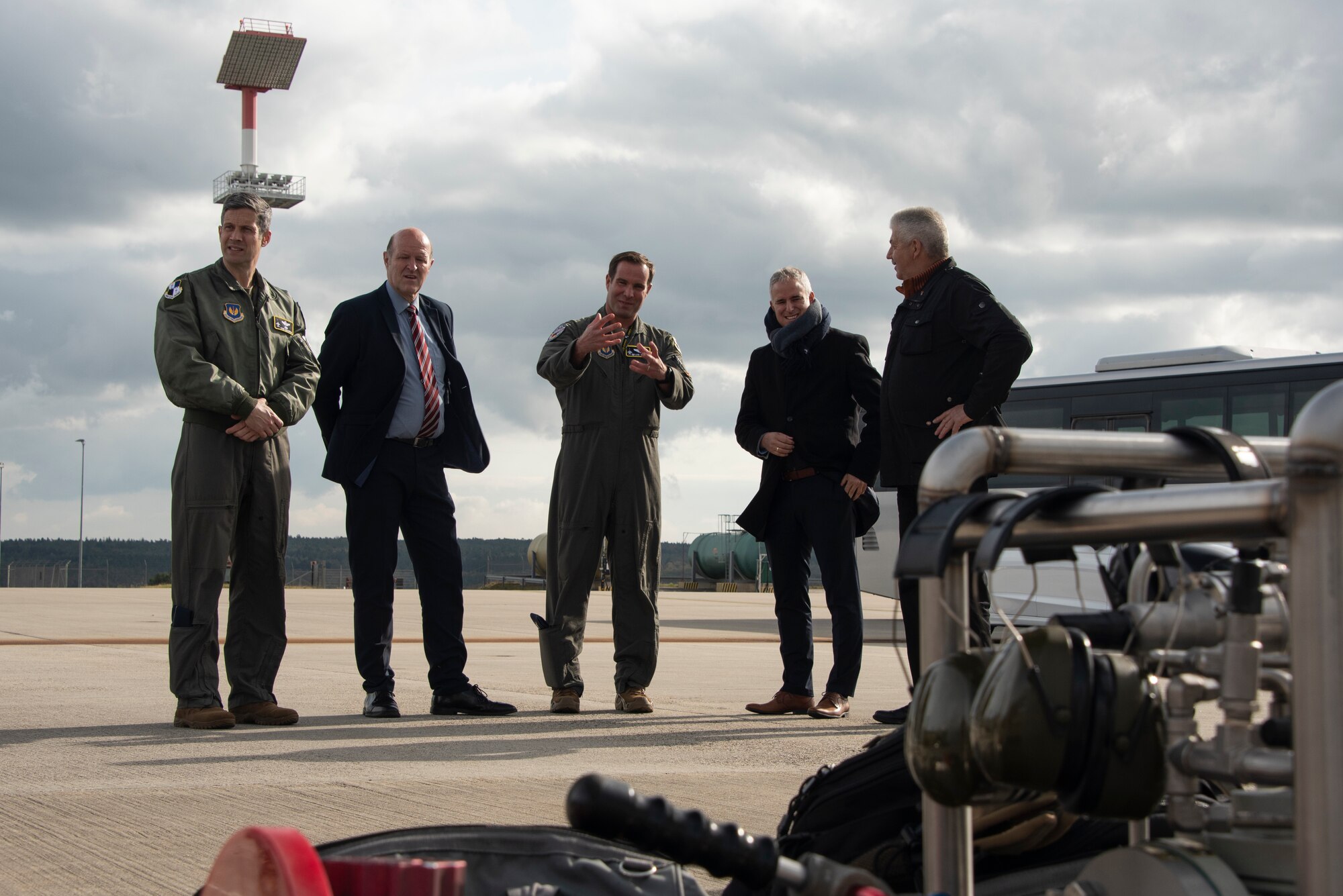 U.S. Air Force Col. Leslie Hauck, 52nd Fighter Wing commander, center, and Col. William McKibban, 52nd FW vice commander, left, shows key leaders from Wittlich and Bitburg, the Versatile Integrated Partner Equipment Refueling (VIPER) kit, at Spangdahlem Air Base, Germany, Oct. 11, 2021. Spangdahlem supports transparency with the German government and local leaders. (U.S. Air Force photo by Staff Sgt. Chance Nardone)