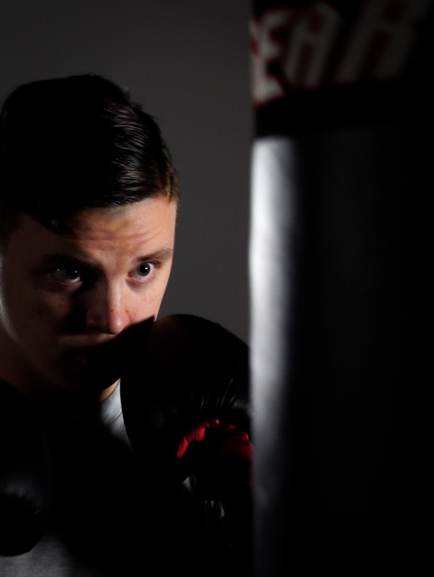 Staff Sgt. Jonathan Cornelius, Base Defense Operations Center controller assigned to the 319th Security Forces Squadron, boxes with a punching bag on Grand Forks Air Force Base, N.D., Mar. 22, 2021. Staying fit to fight helps keep Airmen mission ready to combat America’s near-to-peer adversaries. (U.S. Air Force photo by Airman 1st Class Jack LeGrand)