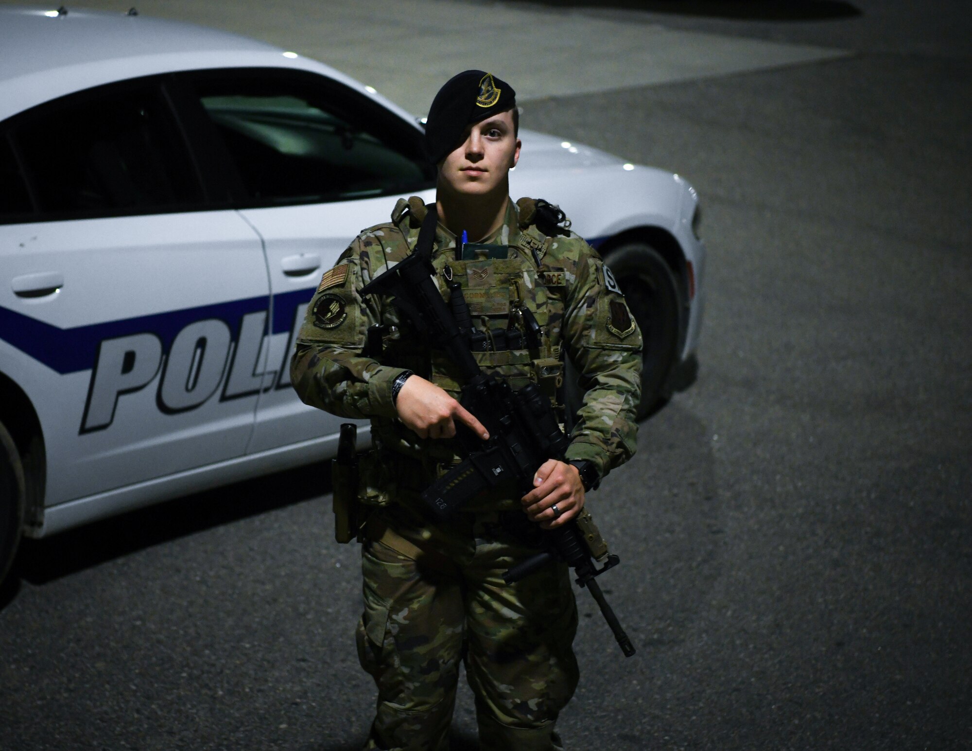 Staff Sgt. Jonathan Cornelius, Base Defense Operations Center controller assigned to the 319th Security Forces Squadron, stands fully equipped for his patrol shift beside a Security Forces vehicle on Grand Forks Air Force Base, N.D., Sep. 23, 2021. Security Forces personnel safeguard Airmen and their families on Grand Forks Air Force Base to ensure the success of the surveillance and reconnaissance mission. (U.S. Air Force photo by Airman 1st Class Jack LeGrand)