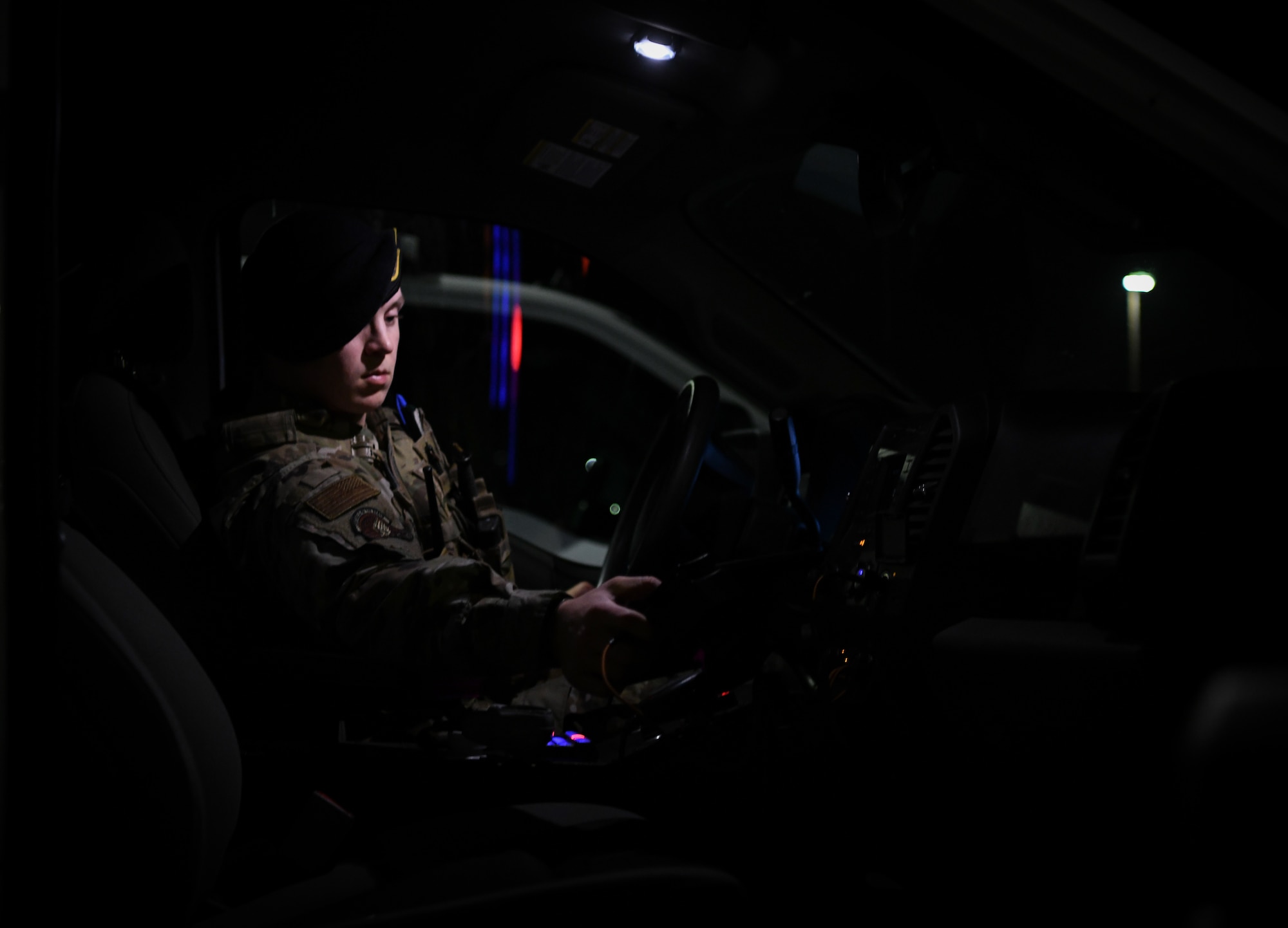 Staff Sgt. Jonathan Cornelius, Base Defense Operations Center controller assigned to the 319th Security Forces Squadron, conducts a shift change-over in a patrol vehicle on Grand Forks Air Force Base, N.D., Sep. 23, 2021. Security Forces Airmen operate 24/7 to keep the Air Force’s intelligence and surveillance assets secure. (U.S. Air Force photo by Airman 1st Class Jack LeGrand)