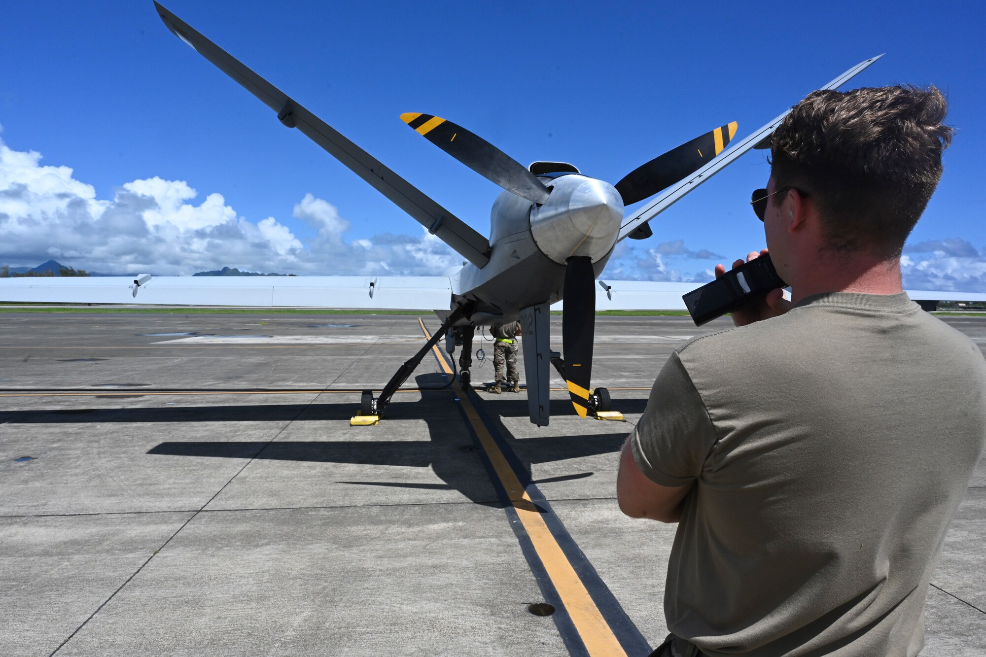 Senior Airman Jacob Way, 49th Aircraft Maintenance Squadron dedicated crew chief, conducts preflight operations checks Sept. 15, 2021, on Marine Corps Base Hawaii. Exercise Agile Combat Employment Reaper is an opportunity to conduct training with joint partners in a maritime environment and in a different airspace. (U.S. Air Force photo by Airman 1st Class Adrian Salazar)