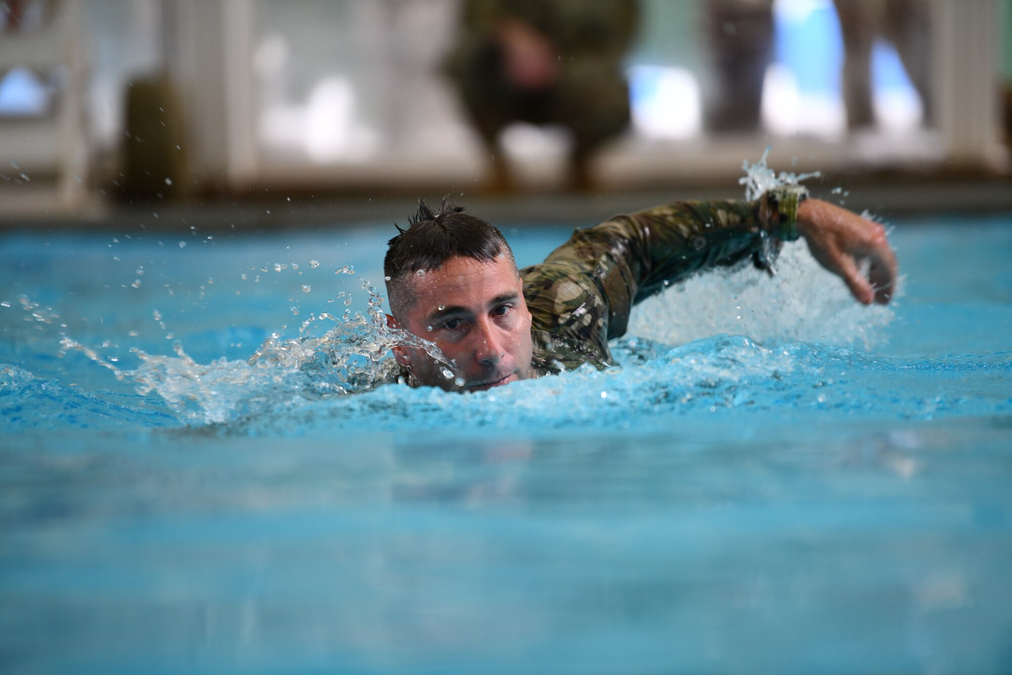Chief Master Sgt. Brett Barbee, 104th Fighter Wing command chief, swims during the German Armed Forces Proficiency Badge event Sept. 9, 2021, at Hanscom Air Force Base, Massachusetts. Participants in the event were tested over a three-day period on swimming, a ruck march, marksmanship, a fitness assessment, and more. (U.S. Air National Guard photo by Randy Burlingame)