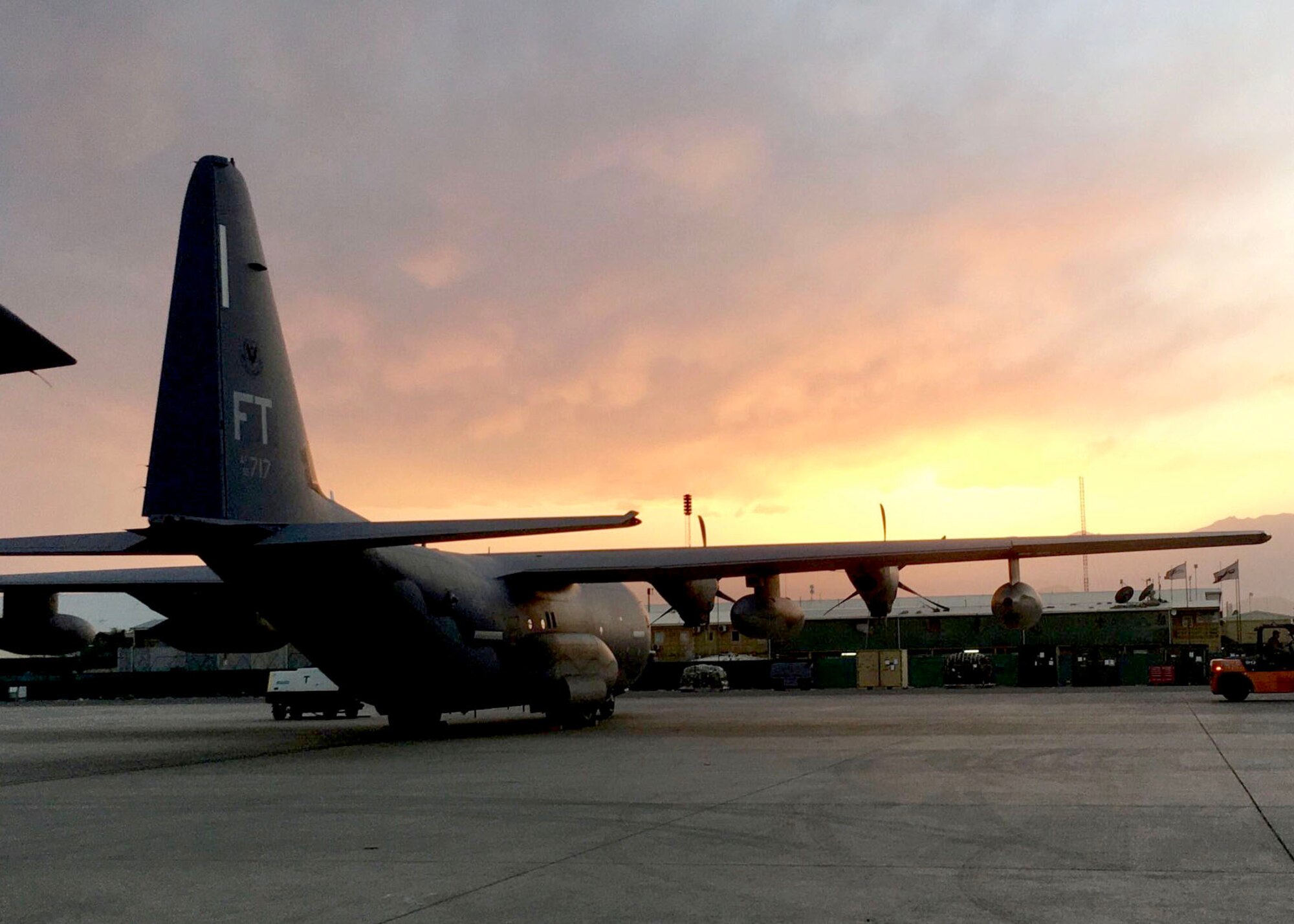 An aircraft sits on the airfield