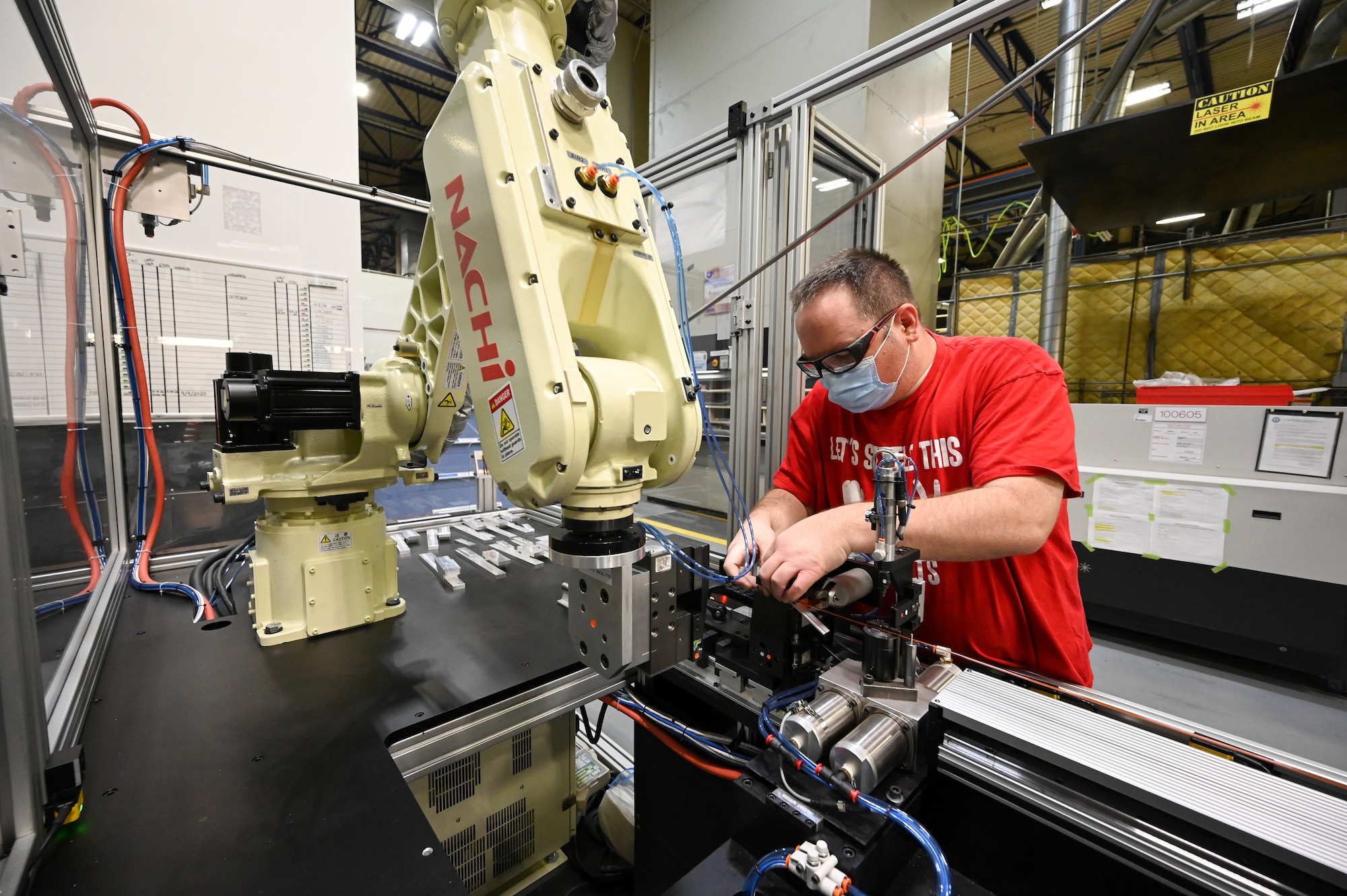 Matthew Noorda, 526th Electronics Maintenance Squadron, prepares an automated forming machine for operation at Hill Air Force Base, Utah, Sept. 24, 2021. The 526th EMXS replaced its process of winding and forming coils by hand with automated equipment in order to save time and money while improving product quality and shop safety. (U.S. Air Force photo by R. Nial Bradshaw)