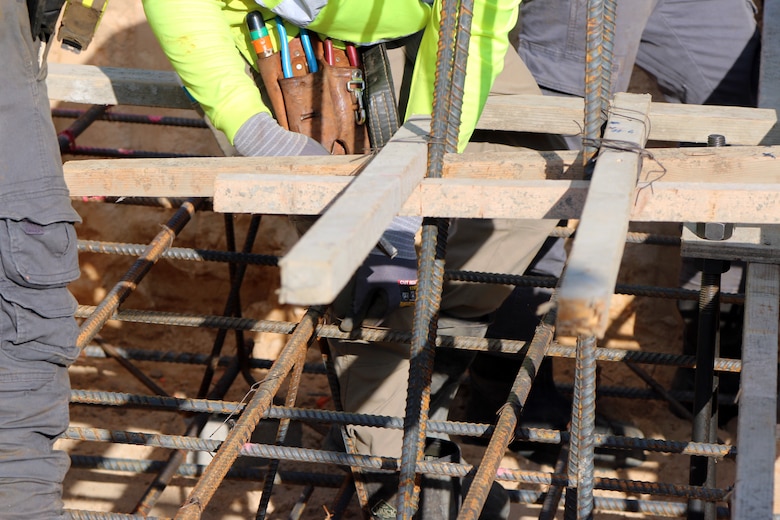 Workers install rebar and prepare for pouring concrete for a company-sized barracks at Fort Jackson, South Carolina as part of the Basic Training Complex Four, Phase Two project.  Formally known as a Basic Combat Trainee Complex, it has all the required facilities to house and fully train the Army’s new recruits, while also being close to field training areas and ranges.  The project has a current cost of about $42 million and is expected to be finished at the end of 2022.
