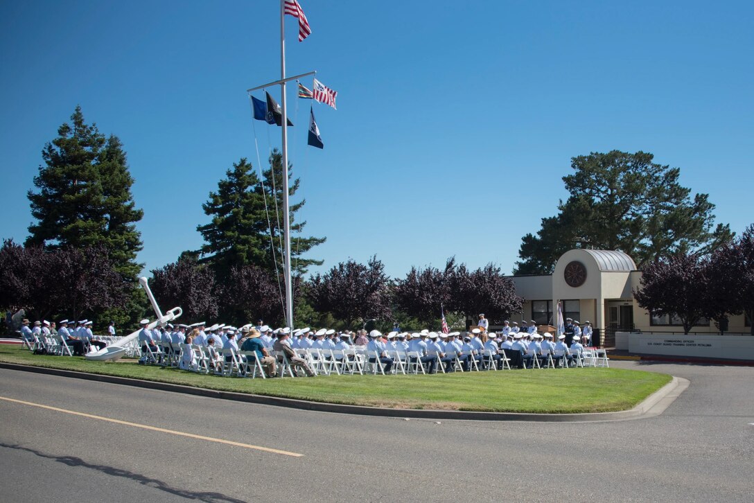 a large crowd of USCG personnel in uniform