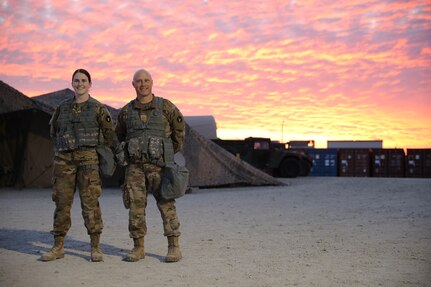 Minnesota National Guard Spc. Emma Brown and her father, Maj. David Brown, shown at Fort Riley, Kansas, are both assigned to Division Headquarters and Headquarters Battalion, 34th Red Bull Infantry Division, and are participating in Warfighter Exercise 22-1.