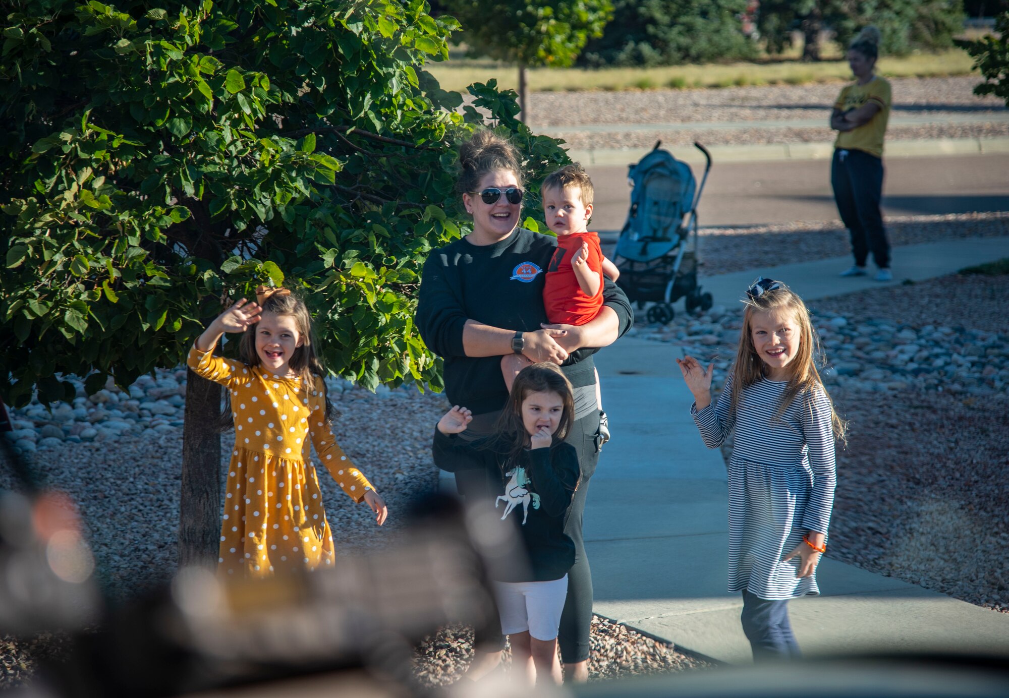family waving