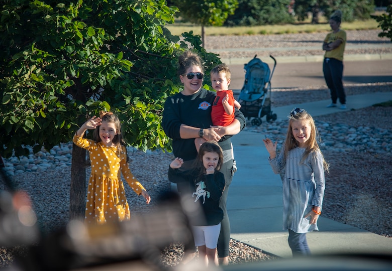 family waving