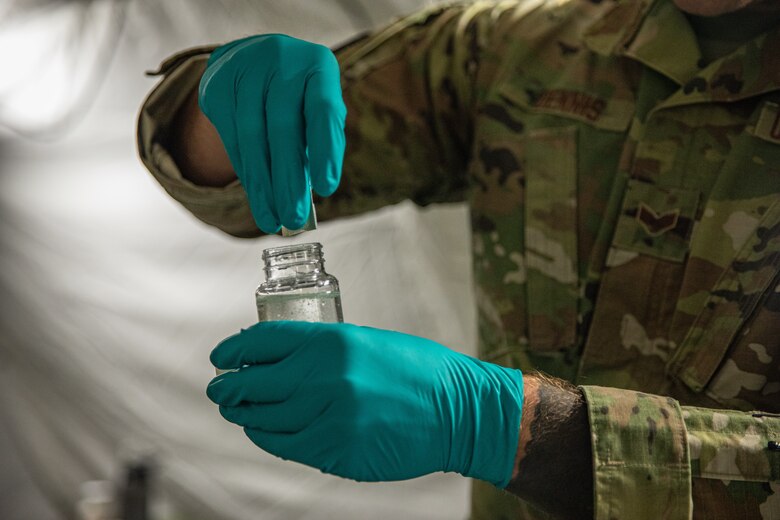 Senior Airman Ethan Dennis, a bioenvironmental engineer attached to Task Force Holloman, tests the water on Holloman Air Force Base, New Mexico, Oct. 7, 2021. The Department of Defense, through U.S. Northern Command, and in support of the Department of Homeland Security, is providing transportation, temporary housing, medical screening, and general support for at least 50,000 Afghan evacuees at suitable facilities, in permanent or temporary structures, as quickly as possible. This initiative provides Afghan personnel essential support at secure locations outside Afghanistan. (U.S. Army photo by Pfc. Anthony Sanchez)