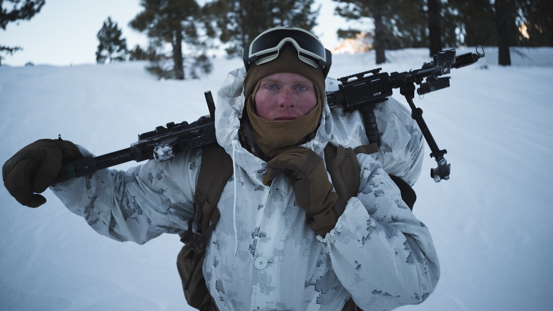 U.S. Marine Corps Lance Cpl. Brady Berning, a machine gun squad leader with 2nd Battalion, 7th Marine Regiment, 1st Marine Division, poses for a photograph during Mountain Training Exercise (MTX) 2-21 Feb. 3, 2021 at Marine Corps Mountain Warfare Training Center, Bridgeport, California. The purpose of MTX is to prepare Marines for harsh weather conditions while enhancing winter warfare skills in cold weather environments. (U.S. Marine Corps Photo by Lance Cpl. Cedar Barnes)