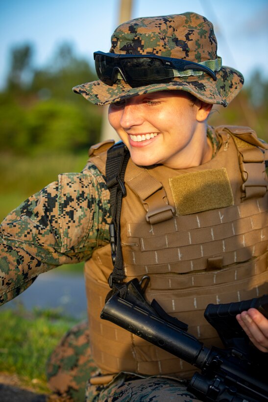 U.S. Marine Corps Lance Cpl. Shelby Karr, a combat graphics specialist with Communication Strategy and Operations, Marine Corps Installations Pacific, prepares to load ammunition into a magazine prior to shooting the new Annual Rifle Qualification (ARQ) on Camp Hansen, Okinawa, Japan, Oct. 5, 2021. The ARQ is a three-day, combat-centric course of fire that tests Marines’ marksmanship skills in a dynamic-shooting environment. Shooters utilize artificial support, engage moving targets as well as engage targets while on the move. (U.S. Marine Corps photo by Cpl. Karis Mattingly)