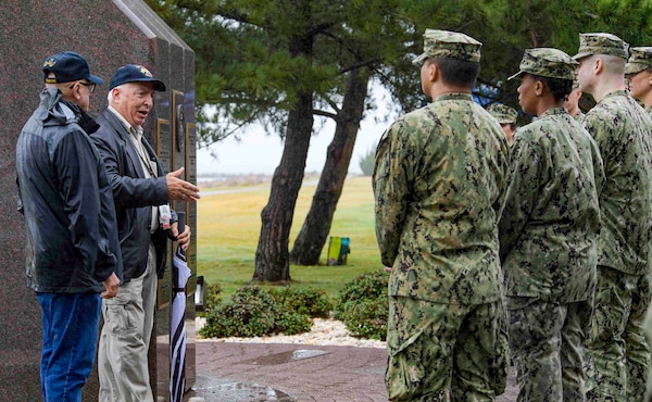 NAVAL STATION NORFOLK (Oct. 12, 2021) Retired Master Chief Sonar Technician Paul Abney, a USS Cole survivor, speaks to chief petty officer selectees at the USS Cole Memorial. Cole friends, family and shipmates gathered on board Naval Station Norfolk for the 21st remembrance of the USS Cole terrorist attack. Seventeen Sailors lost their lives and another 39 sustained injuries while the crew worked for 96 consecutive hours to keep the ship afloat. (U.S. Navy photo by Mass Communication Specialist 1st Class Jacob Milham)