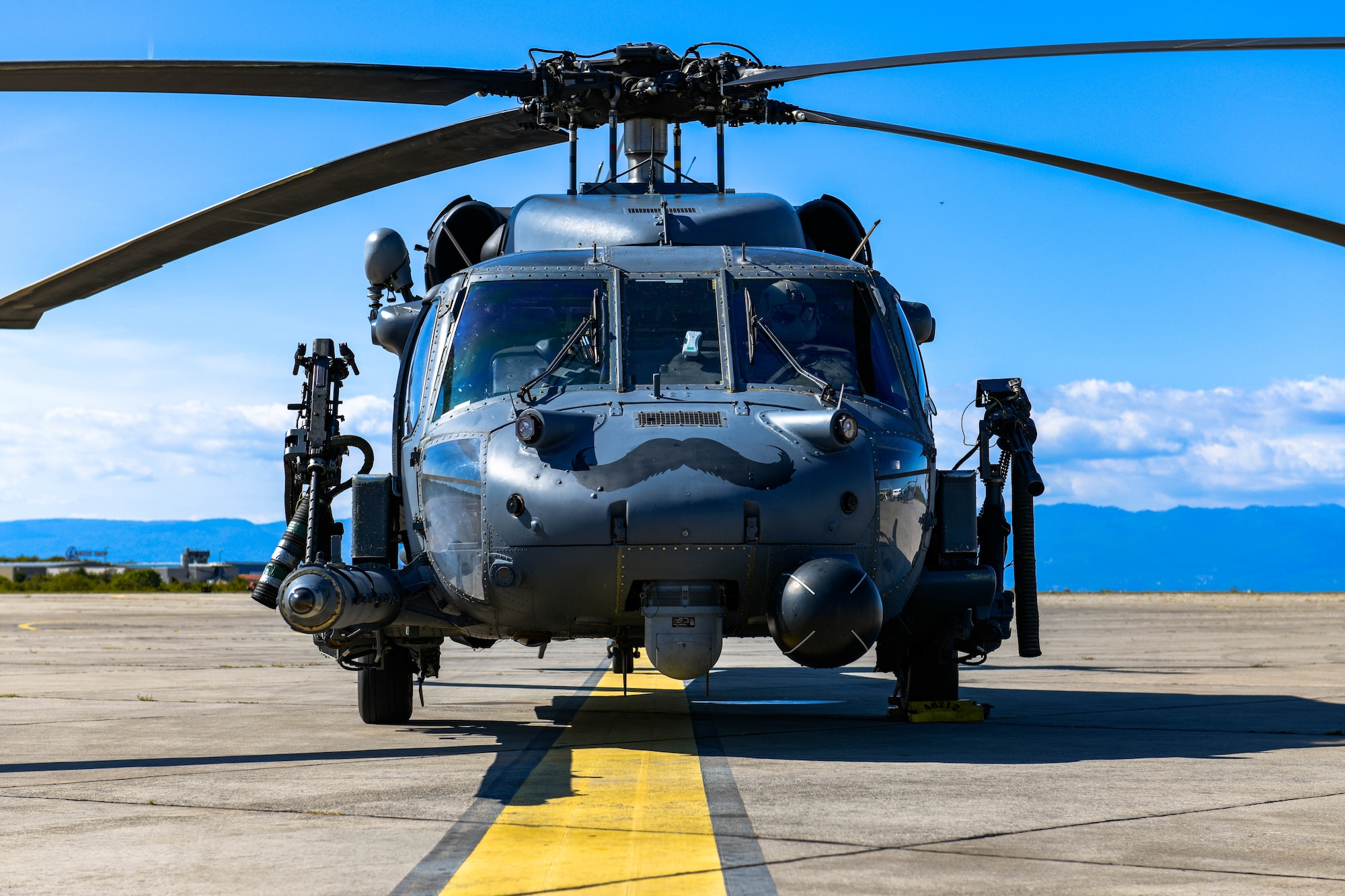 HH-60G Pave Hawk A6212, assigned to the 56th Rescue Squadron, sits on the runway after refueling at an airport in Croatia during its final flight before retirement, Sept. 23, 2021. A6212 is scheduled to be stripped of required components then mounted in front of the 56th Operations Rescue Squadron, building 7300. (U.S. Air Force photo by Senior Airman Brooke Moeder)