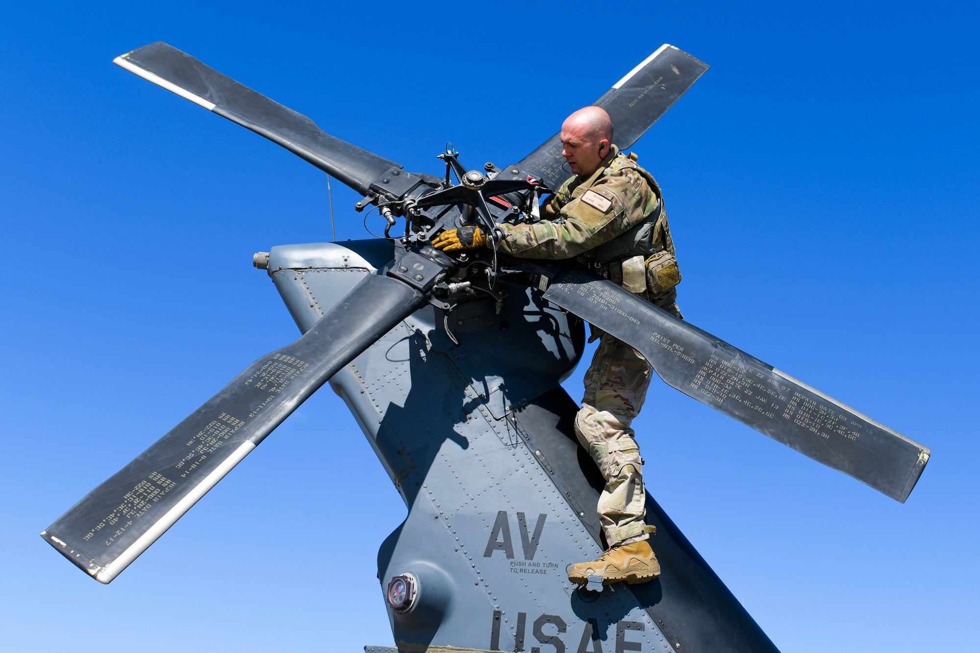 Tech. Sgt. William Mathis, 56th Rescue Squadron special missions aviator evaluator, inspects the blades on the tail rotor of an HH-60G Pave Hawk assigned to the 56th Rescue Squadron during a refuel stop in Croatia, Sept. 23, 2021. There are five helicopters assigned to the 56th RQS with two retiring by the end of 2021. The 56th RQS will receive more HH-60G models in February of 2022 to replace the two that retired. (U.S. Air Force photo by Senior Airman Brooke Moeder)