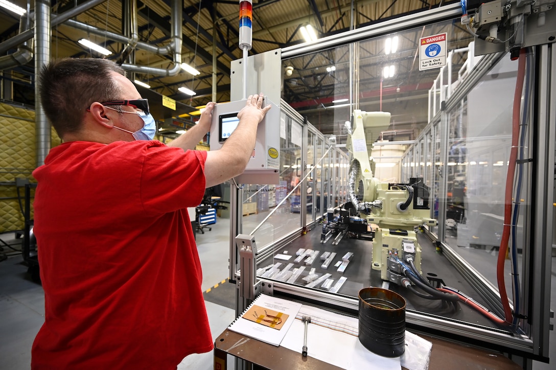 Matthew Noorda, 526th Electronics Maintenance Squadron, prepares an automated forming machine for operation at Hill Air Force Base, Utah, Sept. 24, 2021. The 526th EMXS replaced its process of winding and forming coils by hand with automated equipment in order to save time and money while improving product quality and shop safety. (U.S. Air Force photo by R. Nial Bradshaw)