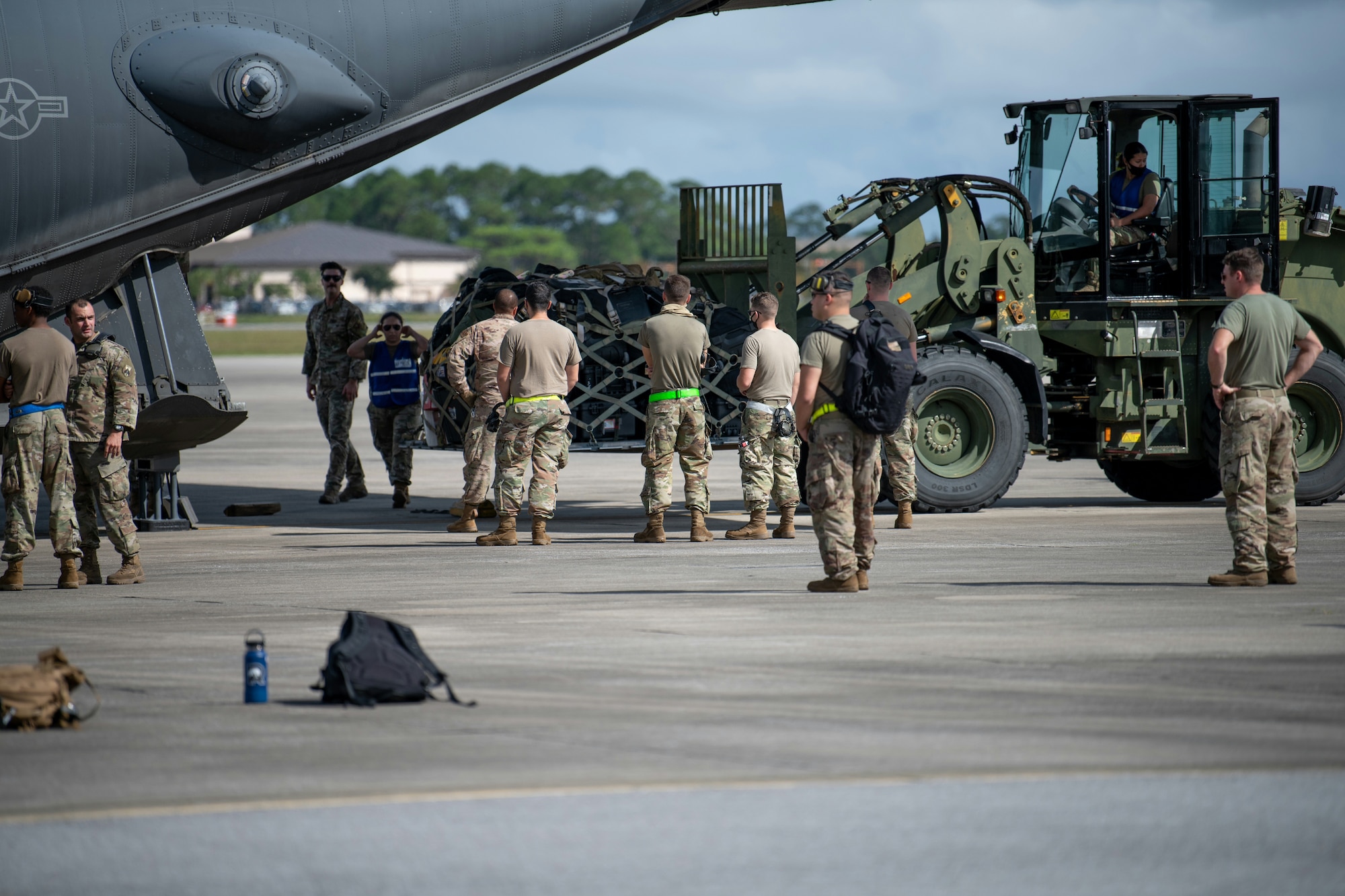 U.S. Air Force Airmen assigned to Hurlburt Field, Florida unload baggage from an MC-130H Combat Talon II aircraft Oct. 6, 2021. Two MC-130H’s returned from a deployment to see their families waiting on the flightline. (U.S. Air Force photo by Staff Sgt. Rito Smith)