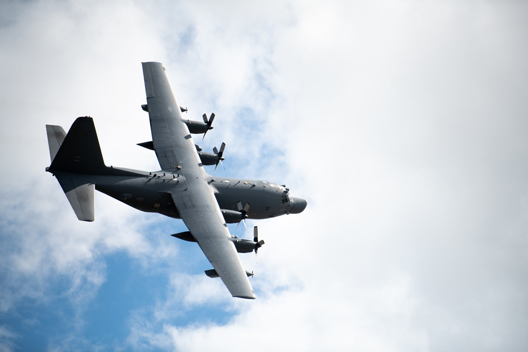 An MC-130H Combat Talon II Aircraft flies over the Hurlburt Field, Florida flightline as they return from a deployment Oct. 6, 2021. Two MC-130H Combat Talon II aircraft crews returned from a deployment to see their families waiting on the flightline. (U.S. Air Force photo by Staff Sgt. Rito Smith)