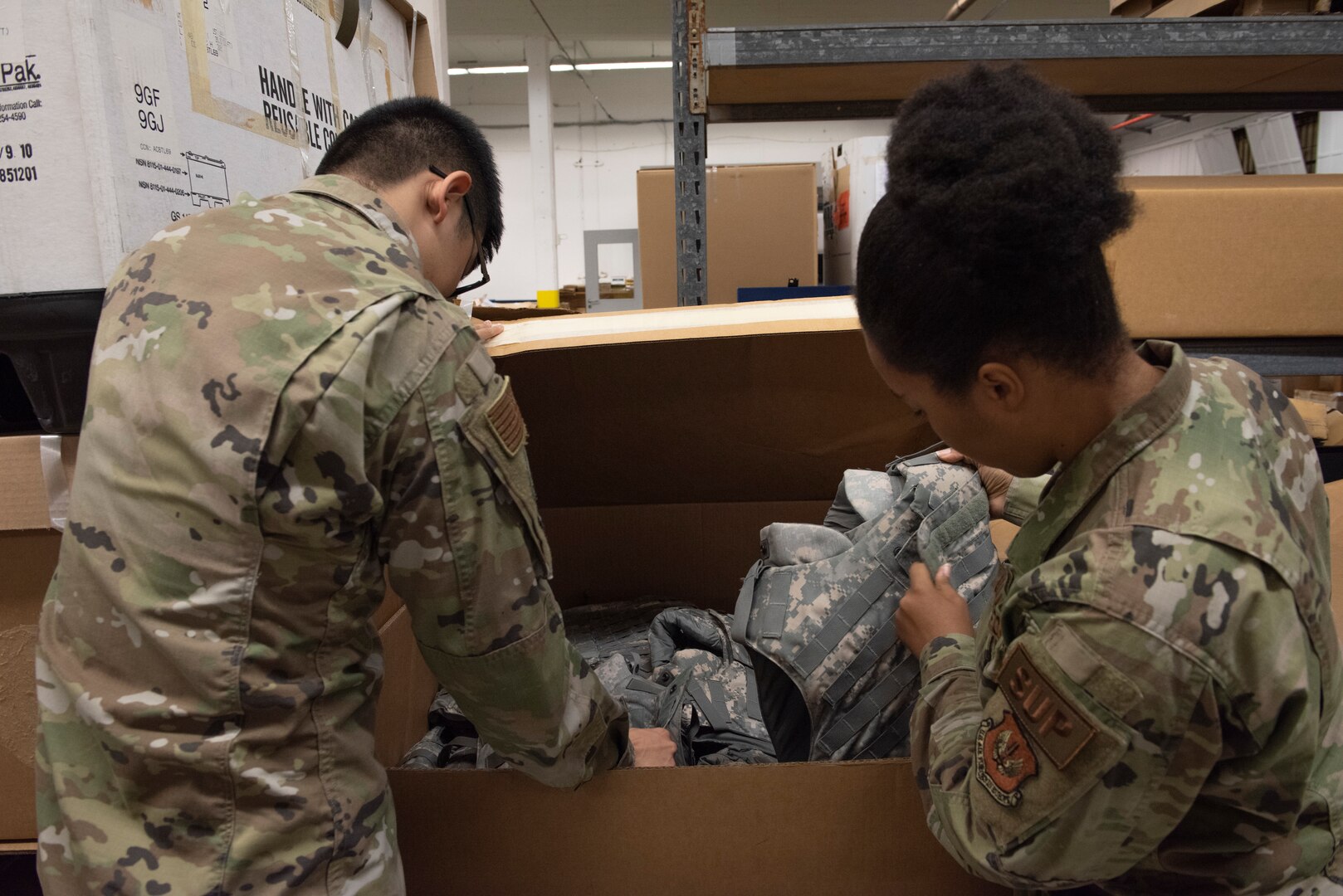 Airmen inspect DRMO items.