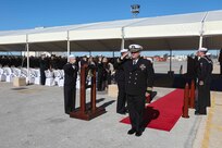 Cdr. Christopher Petro assumes command of the Arleigh Burke-class guided-missile destroyer USS Porter (DDG 78) during a change of command ceremony, Oct. 8, 2021.