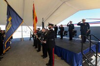 The official party renders a salute with the Color Guard during the National Anthem as part of the Arleigh Burke-class guided-missile destroyer USS Porter (DDG 78) change of command ceremony, Oct. 8, 2021.