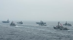 BAY OF BENGAL (Oct. 12, 2021)  U.S. Navy Nimitz-class aircraft carrier USS Carl Vinson (CVN 70), U.S. Navy Ticonderoga-class guided-missile cruiser USS Lake Champlain (CG 57), Royal Australian Navy fleet replenishment vessel HMAS Sirius (O 266), Japan Maritime Self-Defense Force (JMSDF) Izumo-class helicopter destroyer JS Kaga (DDH 184), Royal Indian Navy Rajput-class destroyer INS Ranvijay (D55), U.S. Navy Arleigh Burke-class guided-missile destroyer USS Stockdale (DDG 106) and JMSDF Murasame-class destroyer JS Murasame (DD 101) transit the Bay of Bengal as part of MALABAR 2021, Oct. 12, 2021. MALABAR 2021 is a maritime exercise designed to improve integration, address common maritime security priorities and concerns, enhance interoperability and communication, and strengthen enduring relationships between the Royal Australian Navy, Royal Indian Navy, JMSDF, and U.S. maritime forces. (U.S. Navy photo by Mass Communication Specialist 2nd Class Russell Lindsey)