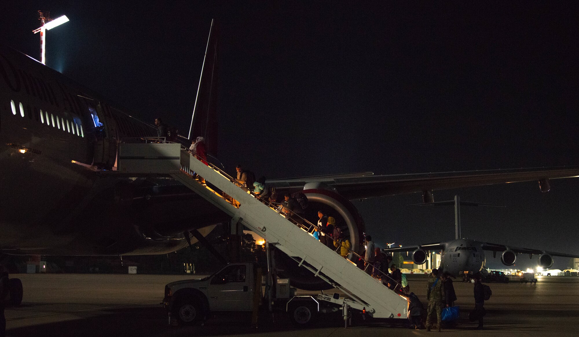 Passengers board outbound flight.