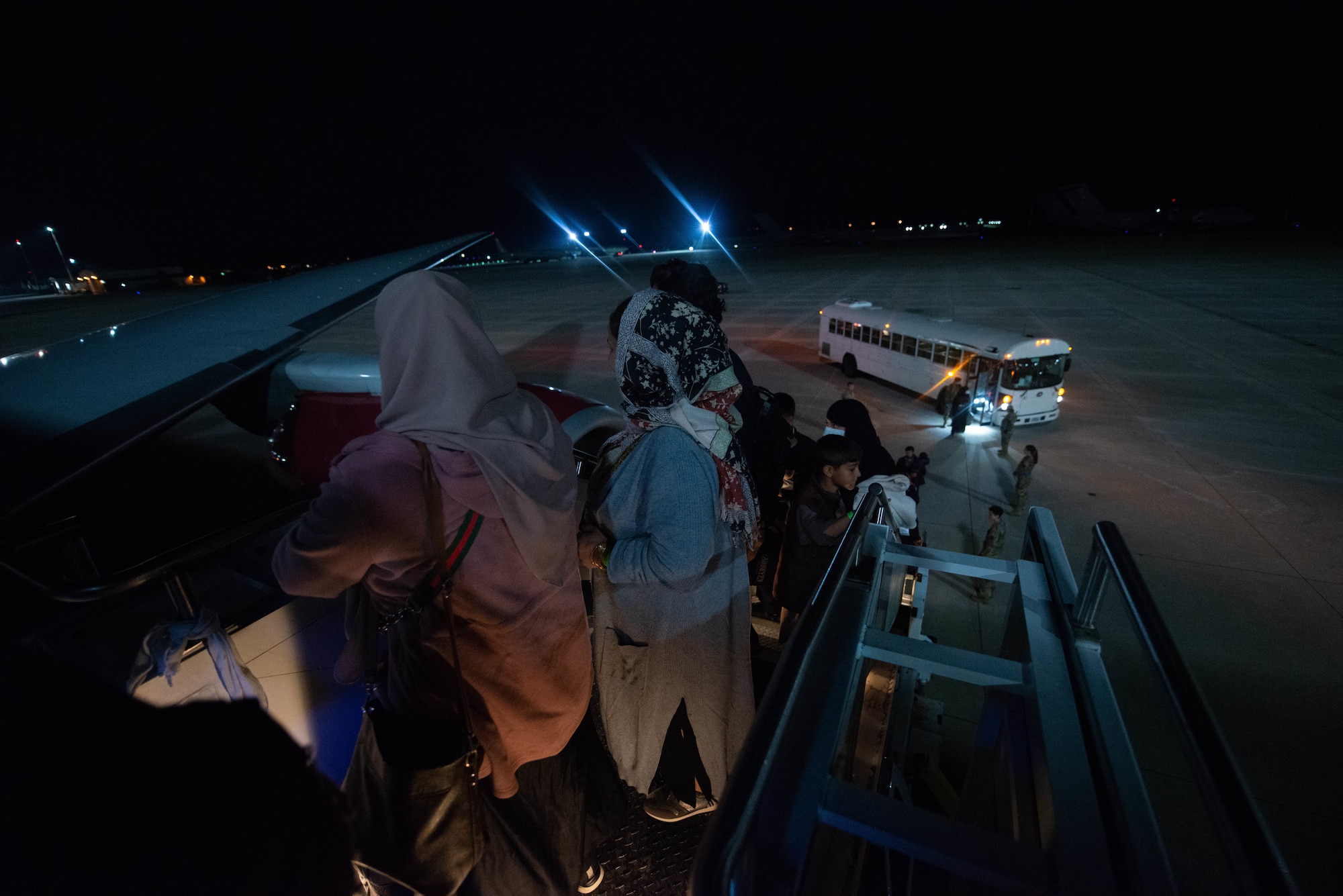 Evacuees board flight outbound from Ramstein Air Base.