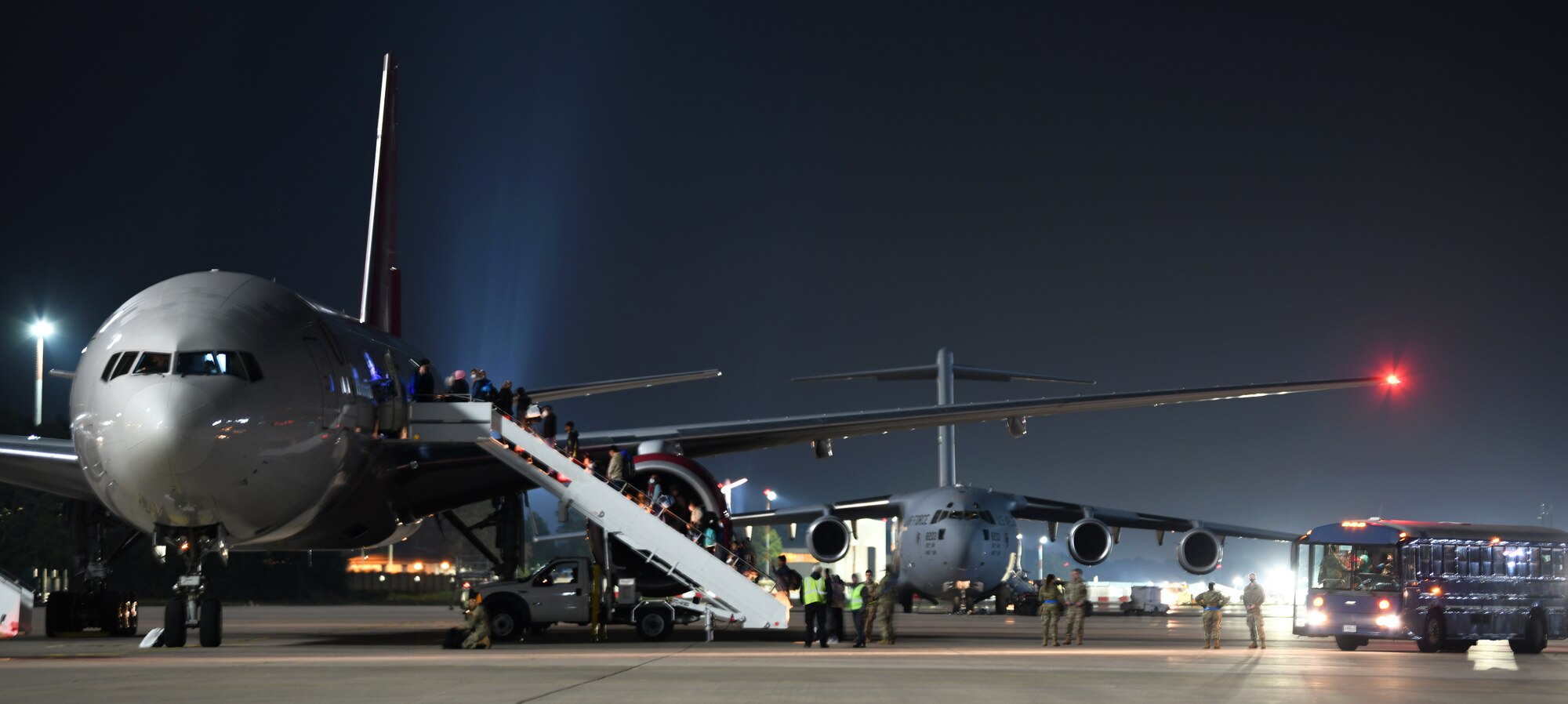 Passengers board outbound flights.